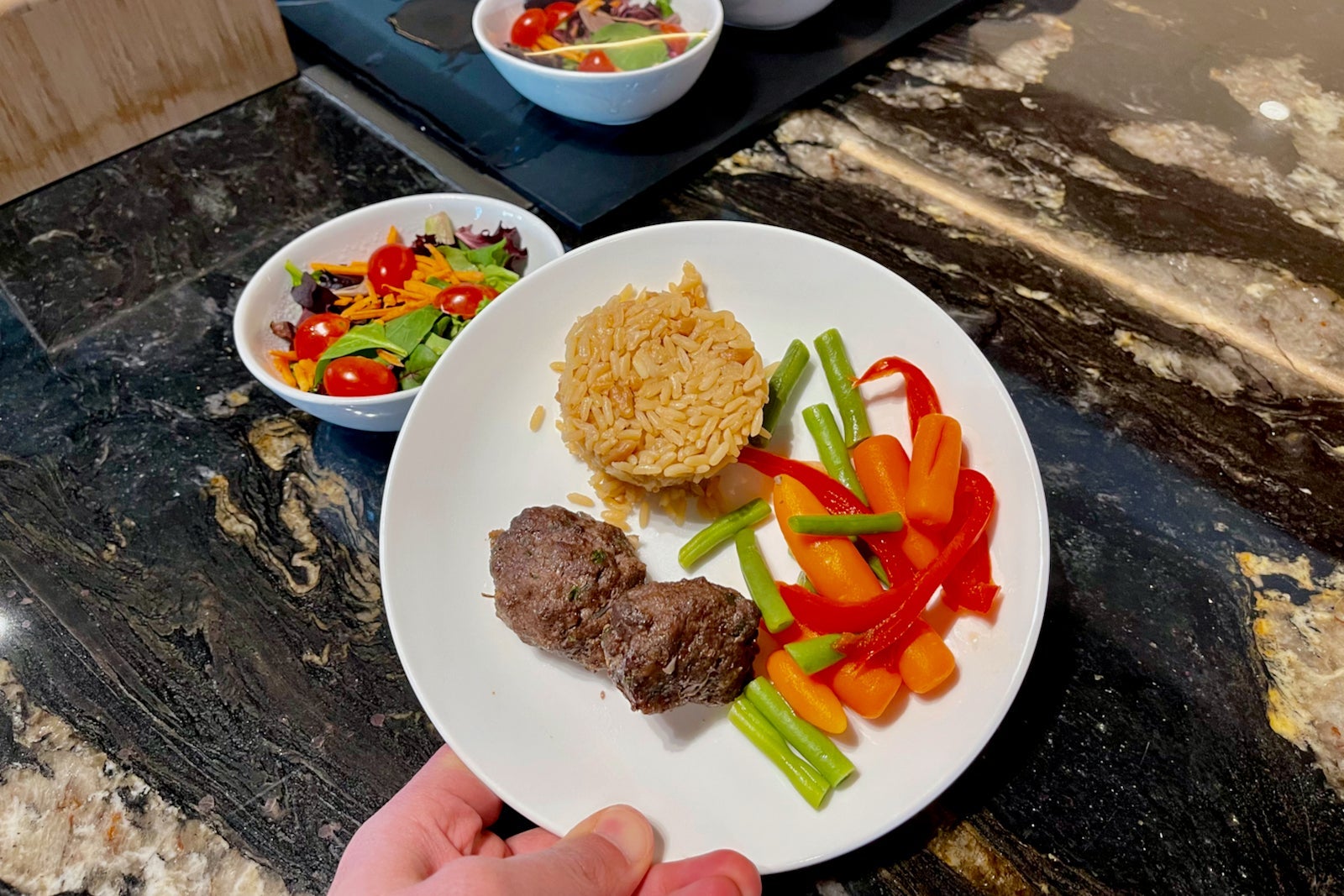 a plate of food from an airline lounge buffet