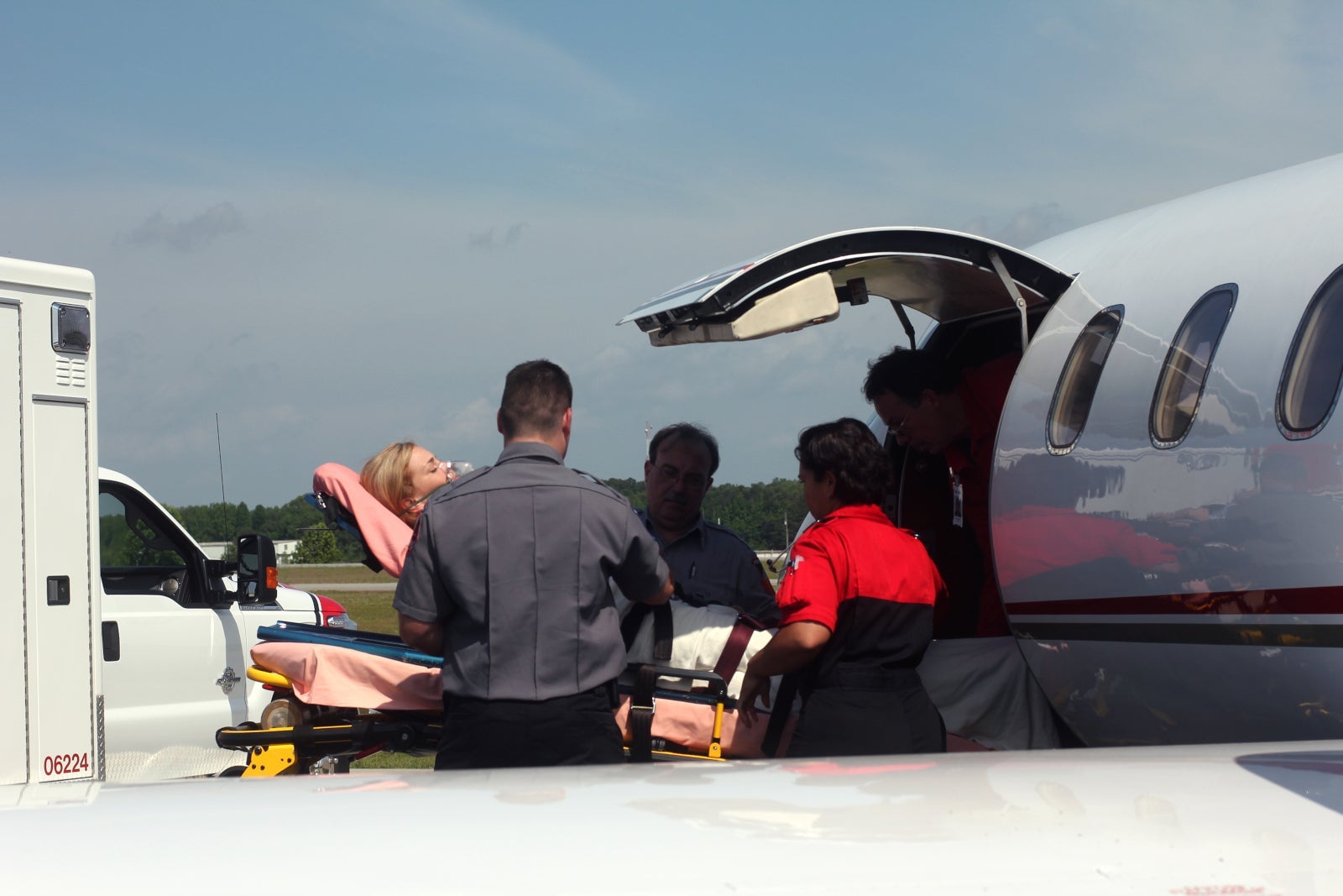 Medjet loading patient into plane