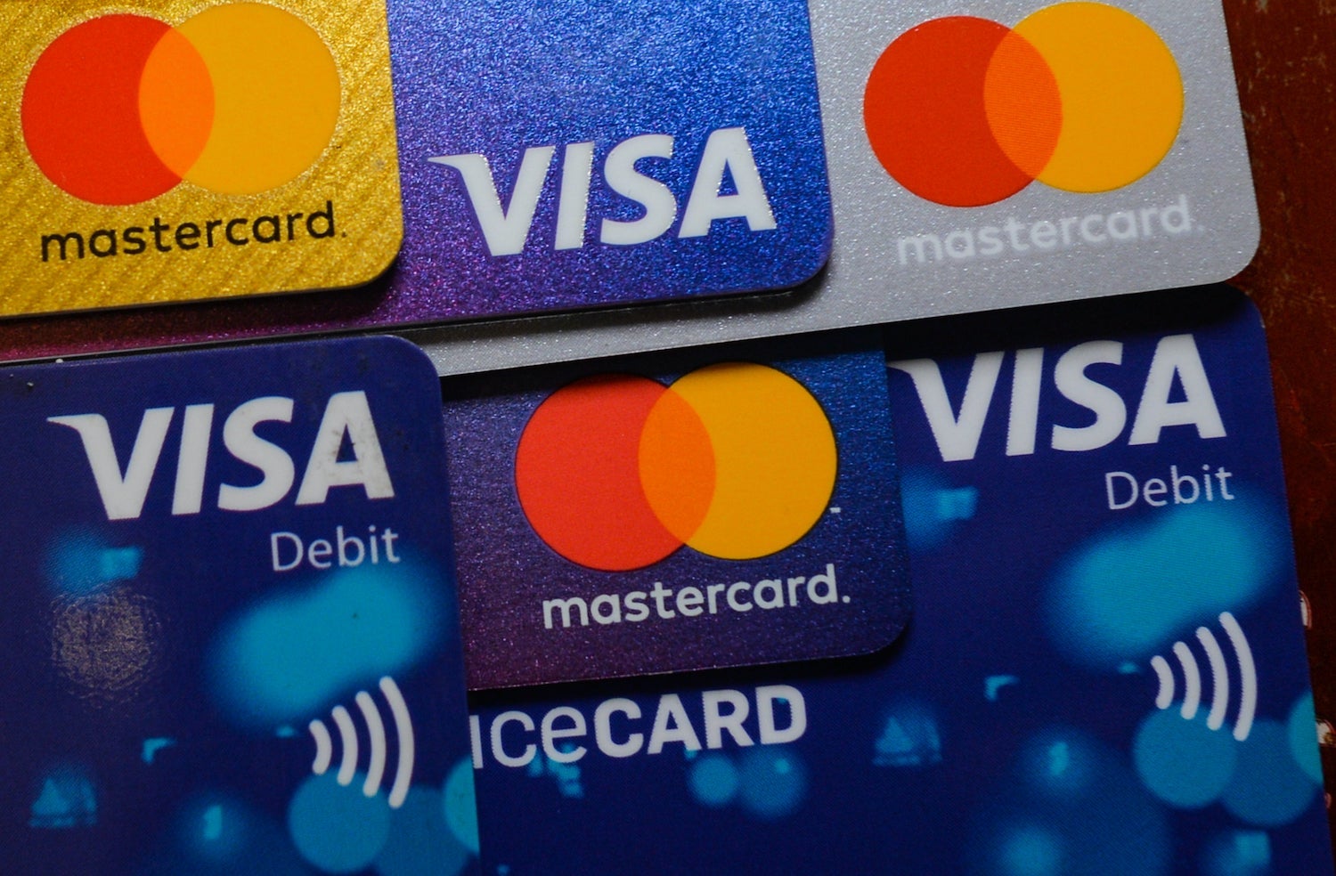 Mastercard and Visa Credit and Debit Cards Stacked