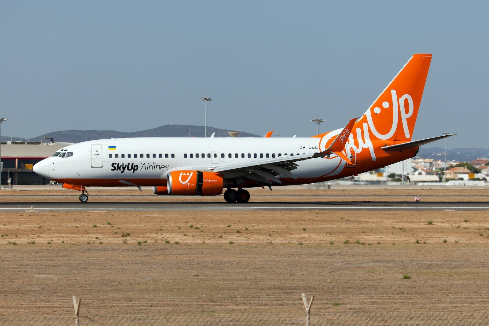 SkyUp Airlines 737-700 on a runway