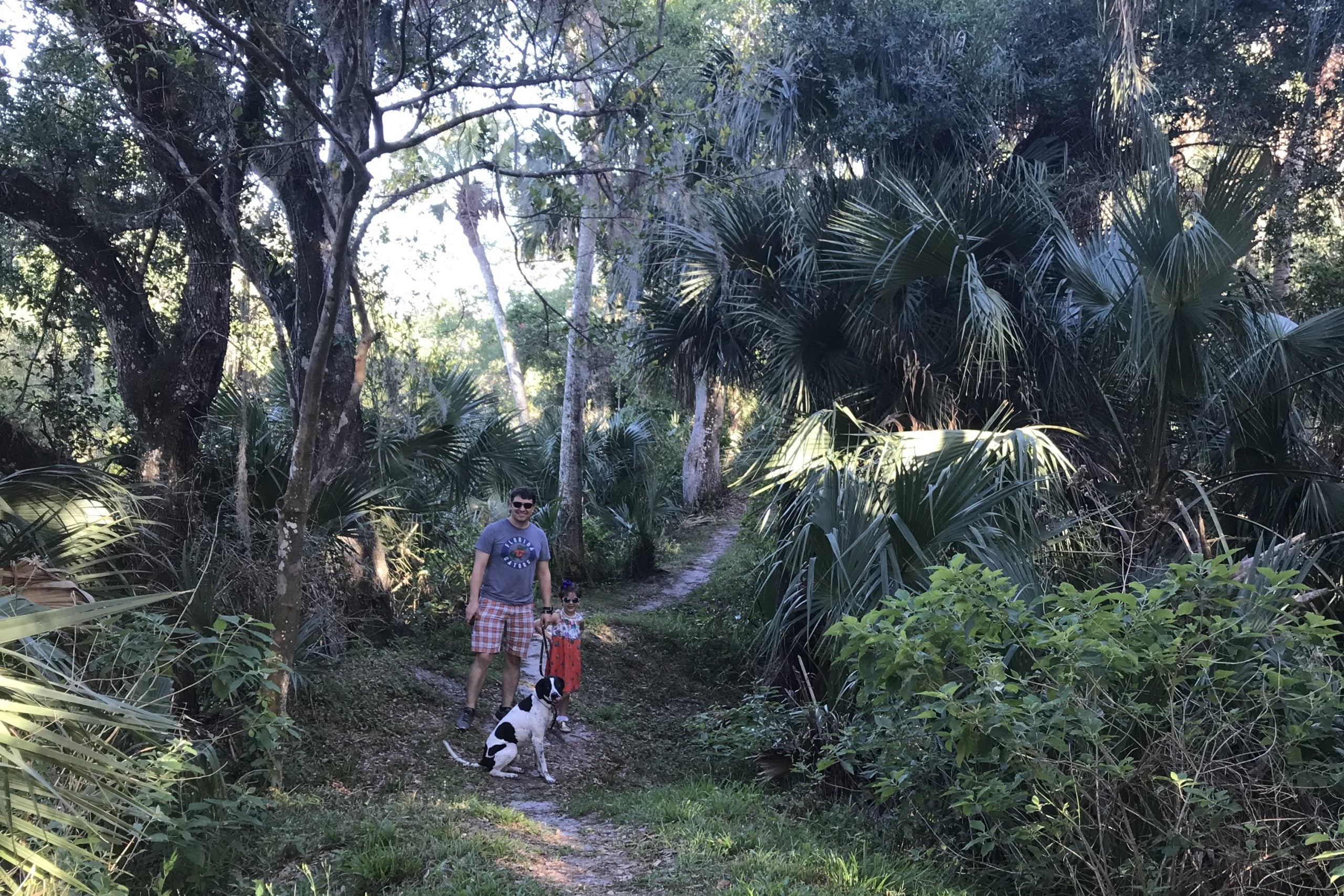 TPG's Nick Ewen exploring a local preserve with his daughter and dog