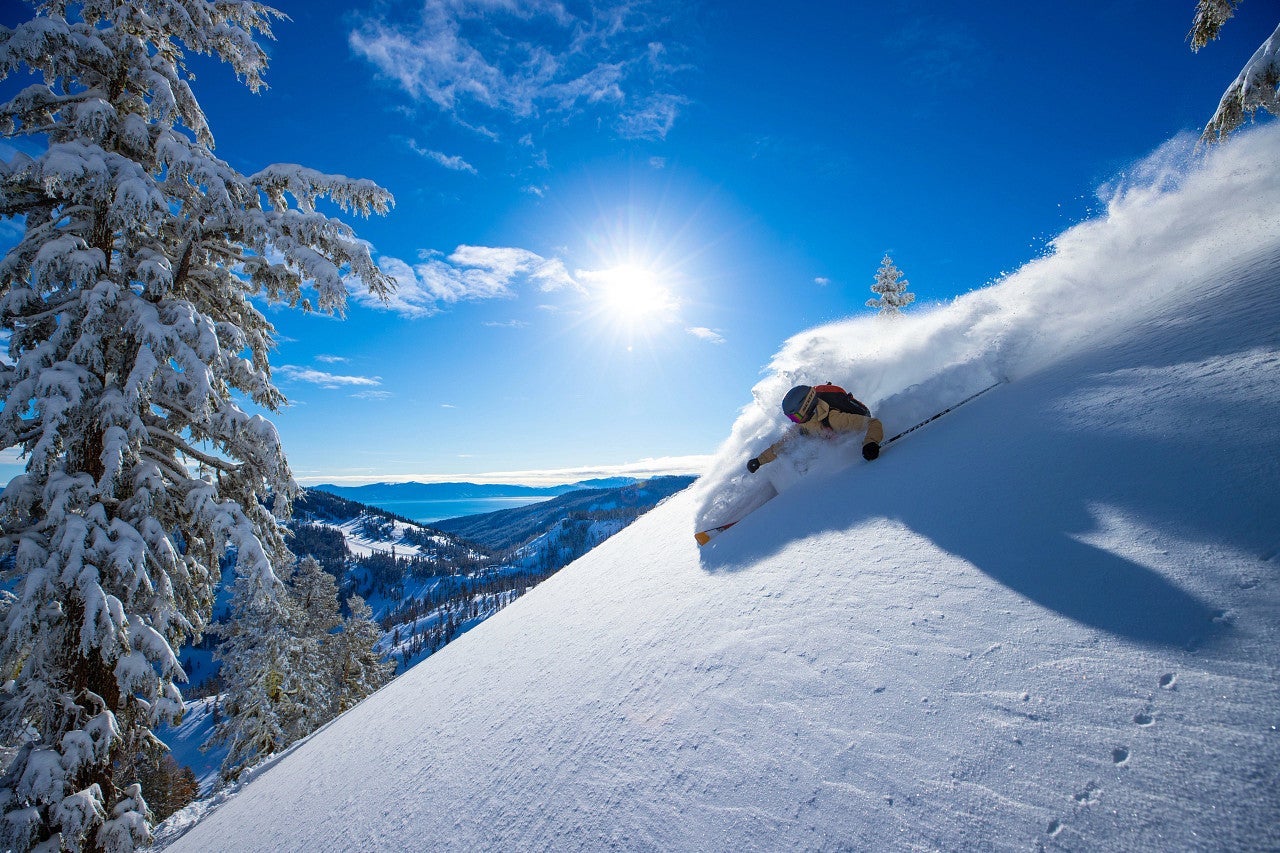 A skiier at an Ikon Pass participating resort