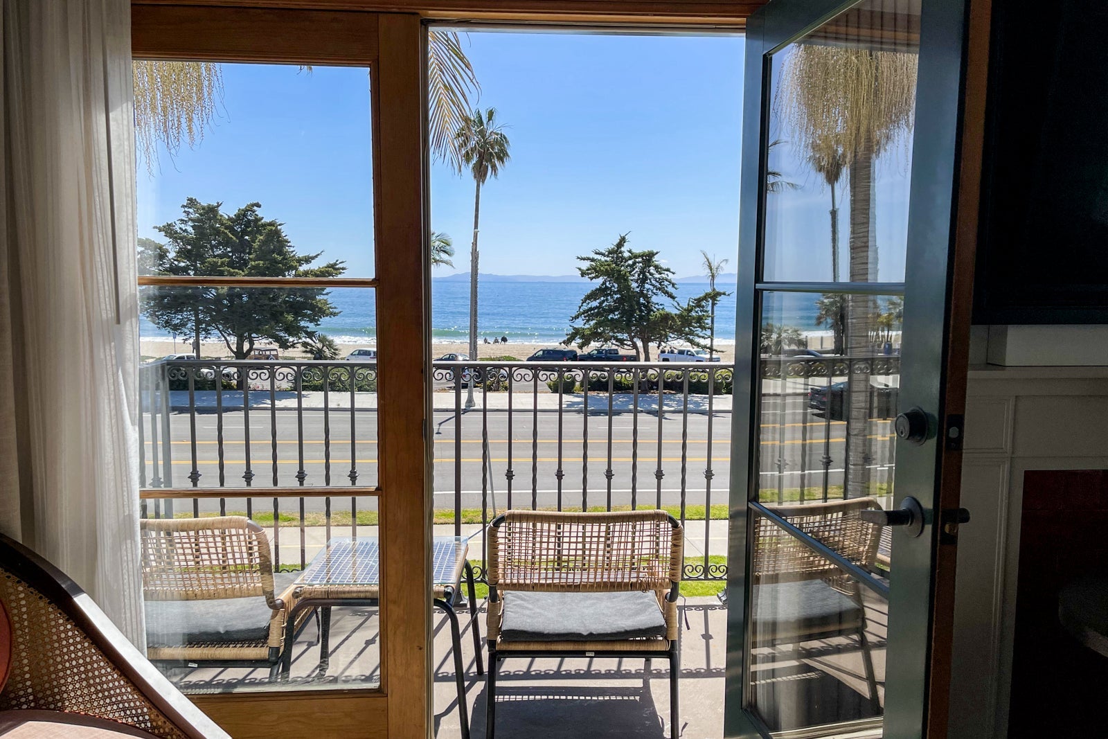 looking out French doors toward the ocean from a hotel room