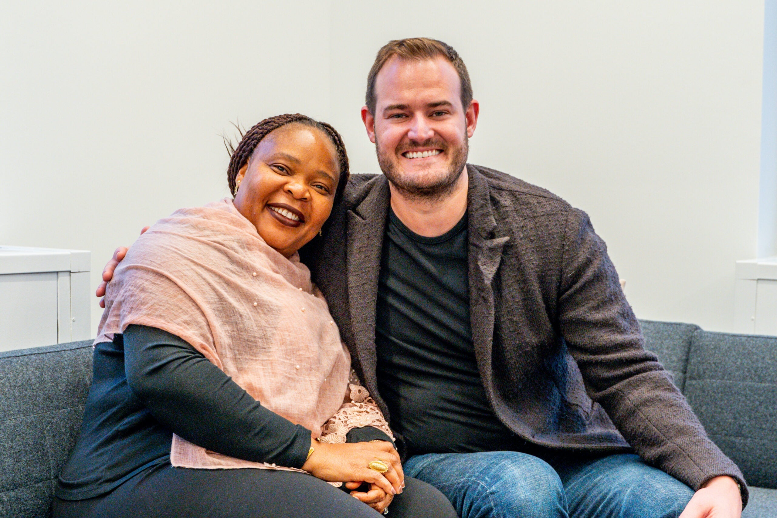 A picture of Leymah Gbowee with TPG's founder and CEO, Brian Kelly