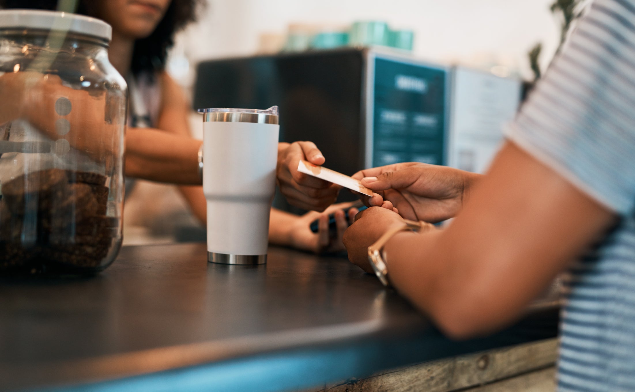 Woman paying with a credit card