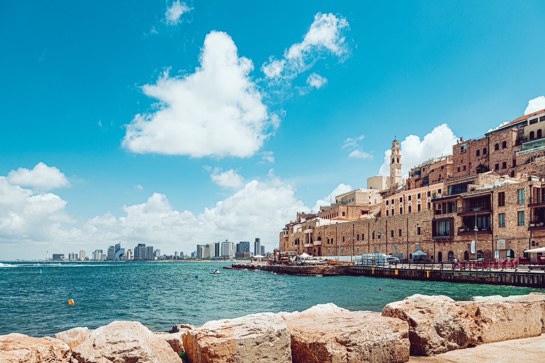 Old Jaffa and distant view of modern Tel Aviv buildings. (Photo by kolderal/Getty Images)