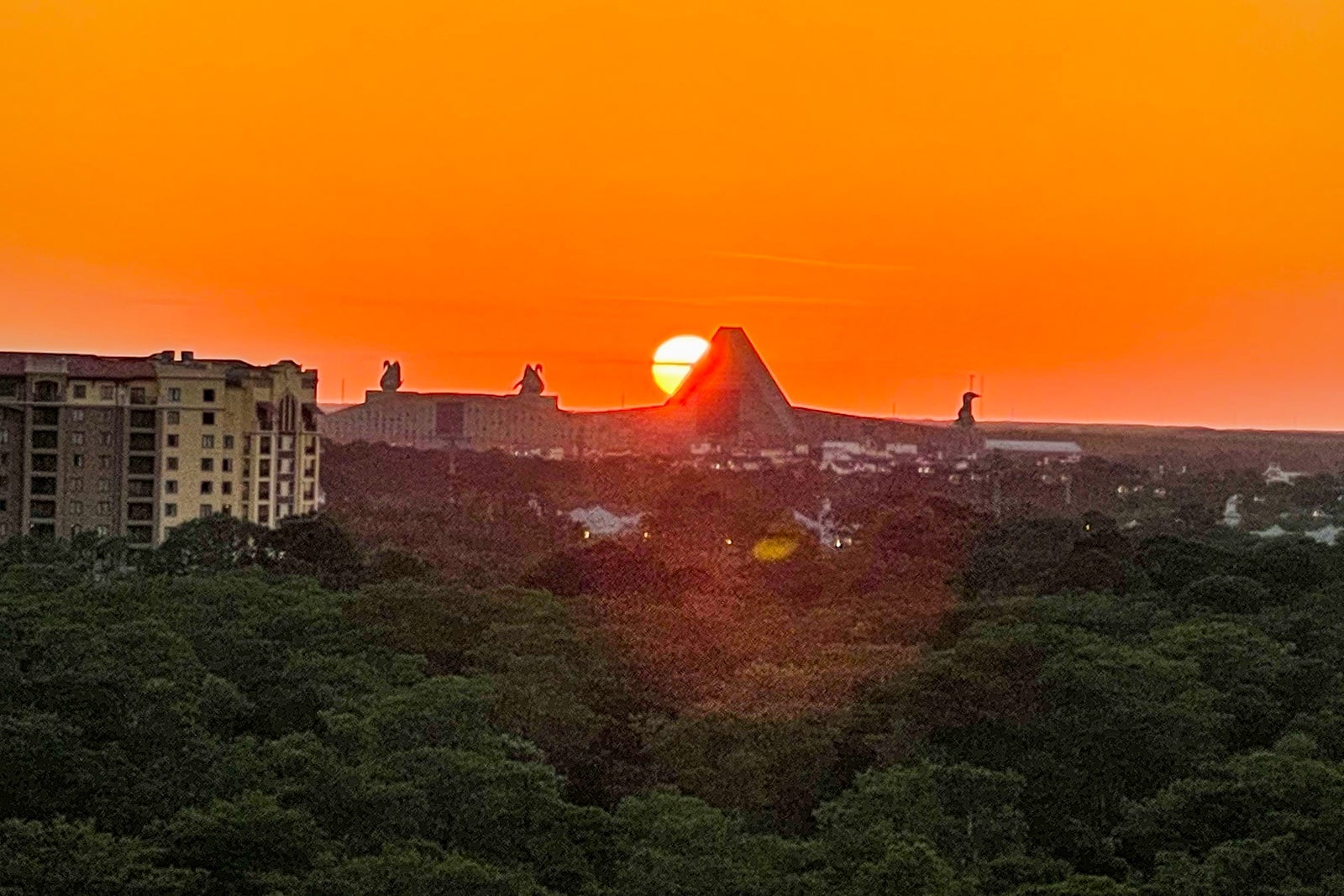 sunset over Disney's Swan & Dolphin hotels as seen from a suite at the JW Marriott Orlando Bonnet Creek