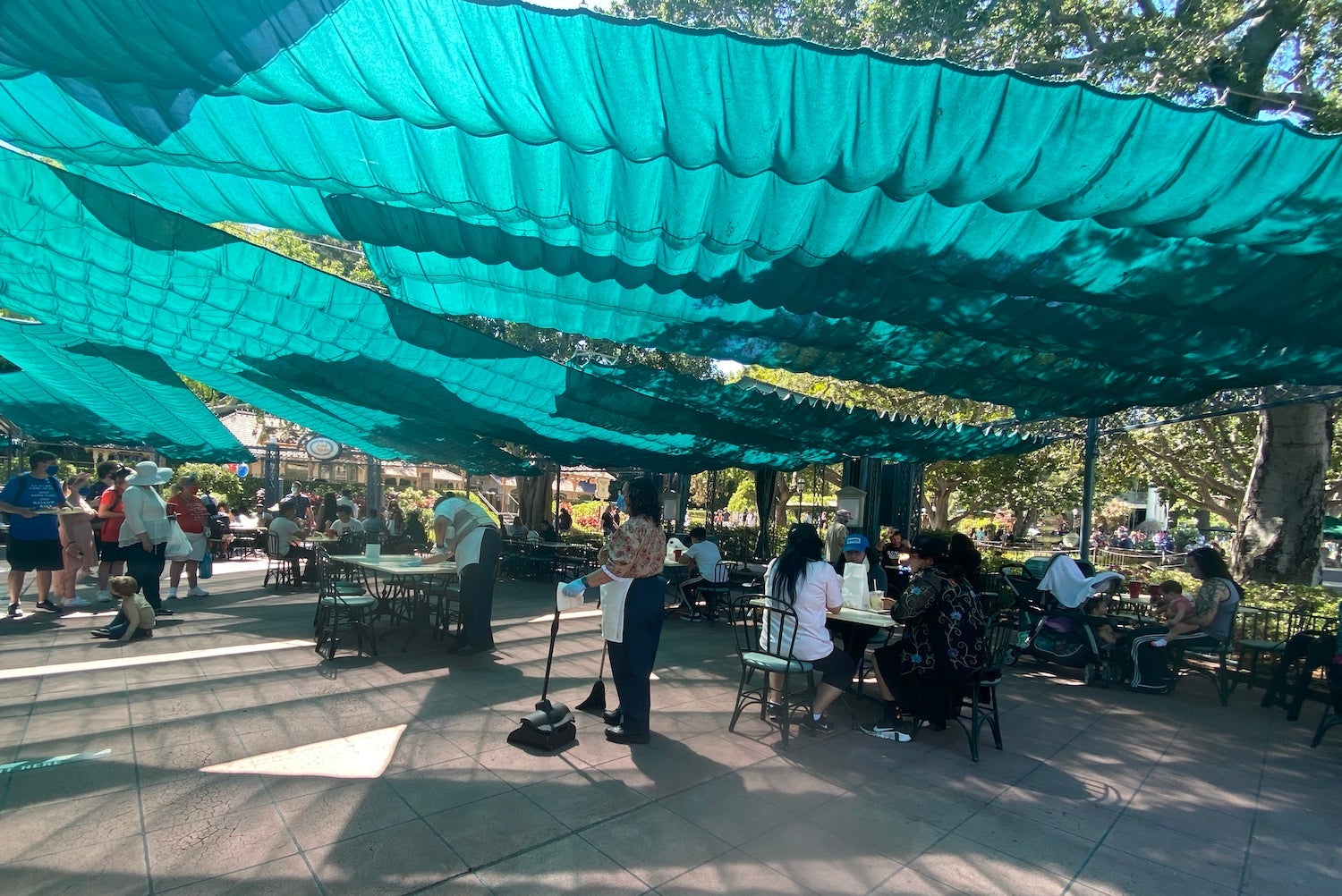 Staff at Disney's French Market Restaurant sanitizing tables