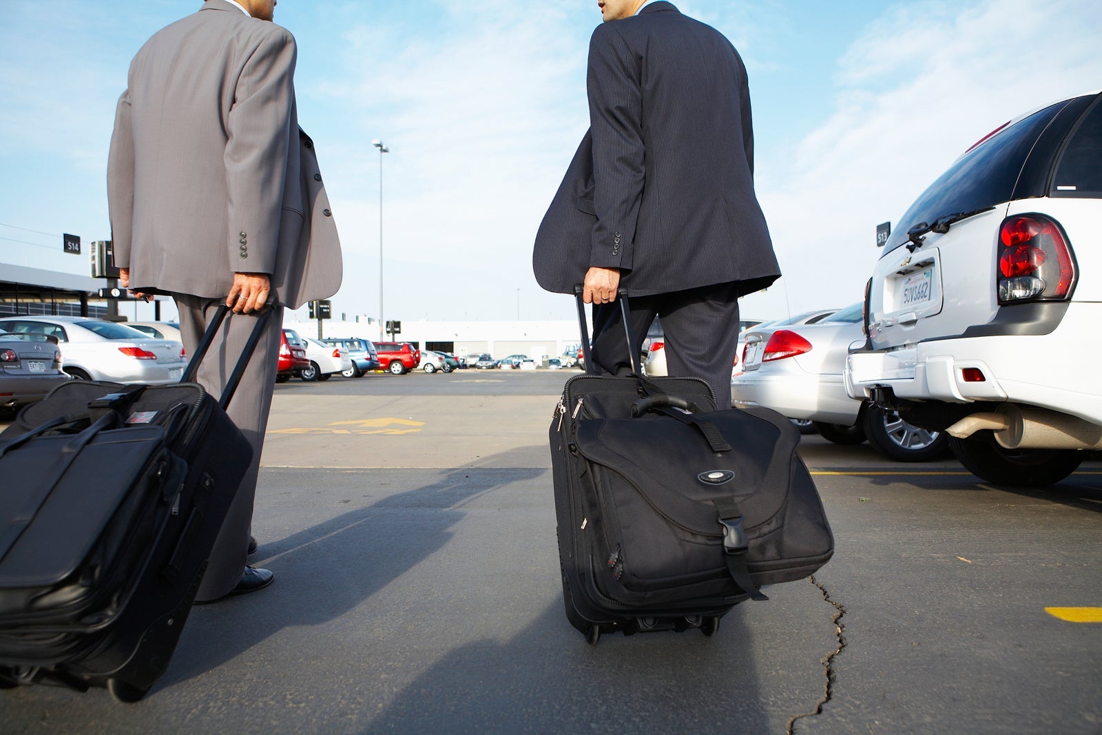 business travelers in a parking lot