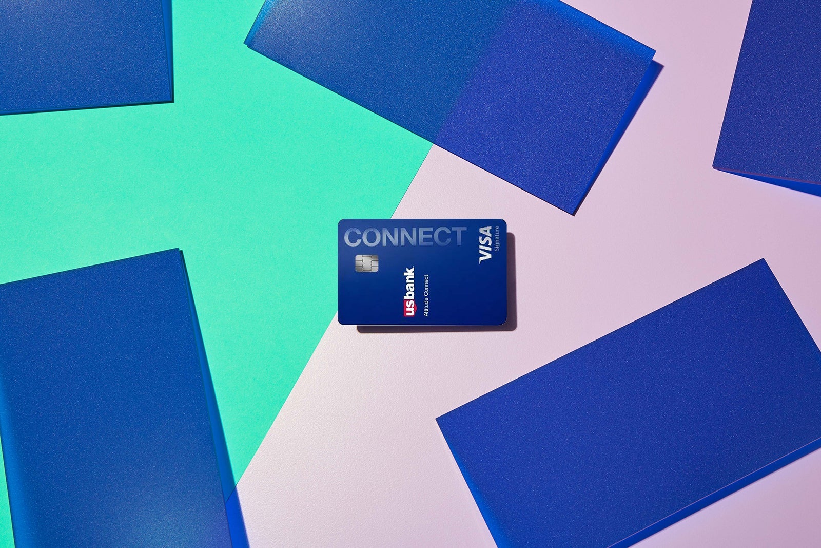 a credit card against a multi-colored background