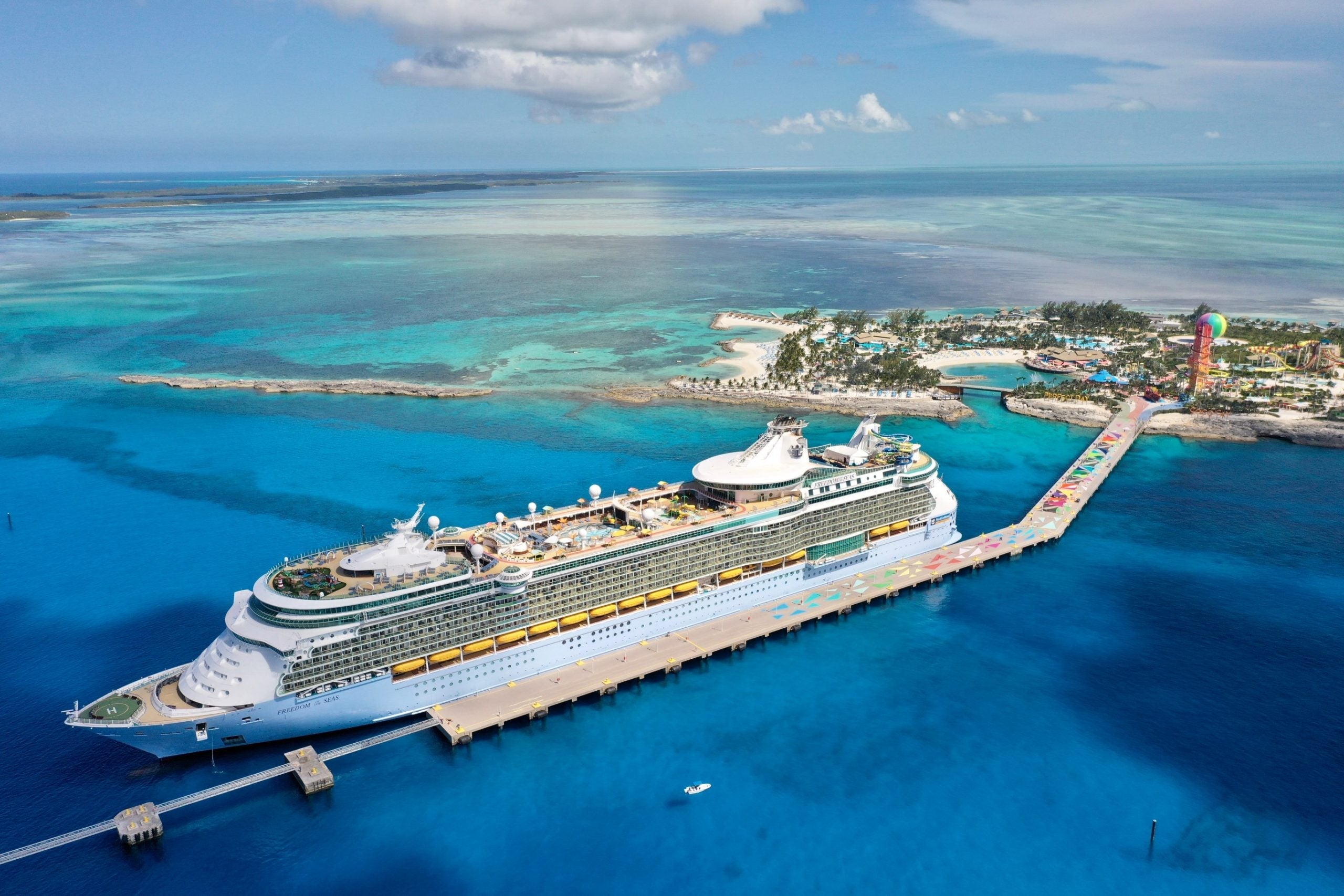 An aerial view of Royal Caribbean's Freedom of the Seas cruise ship docked along a pier in the Caribbean