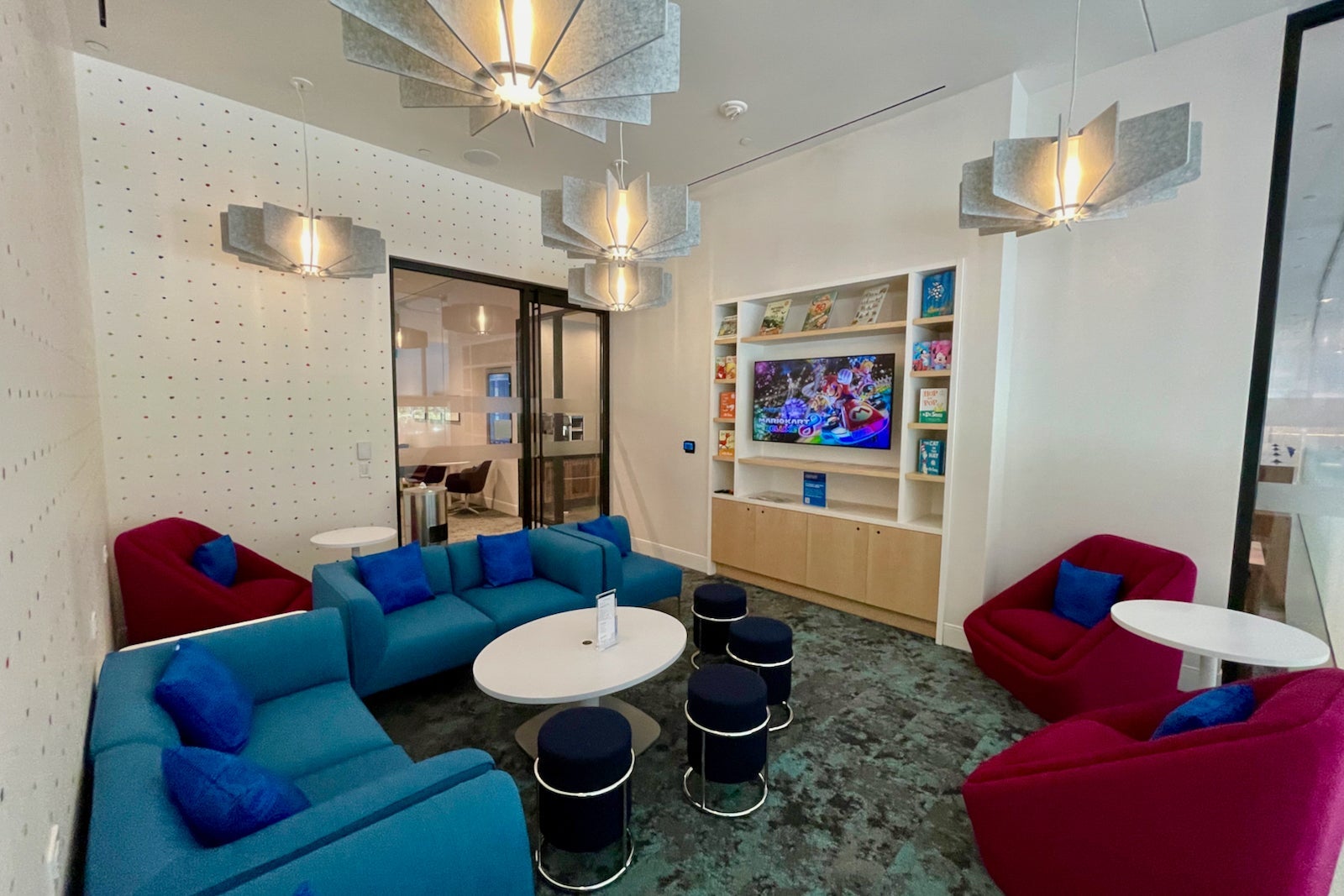 seating around a TV at an airport lounge