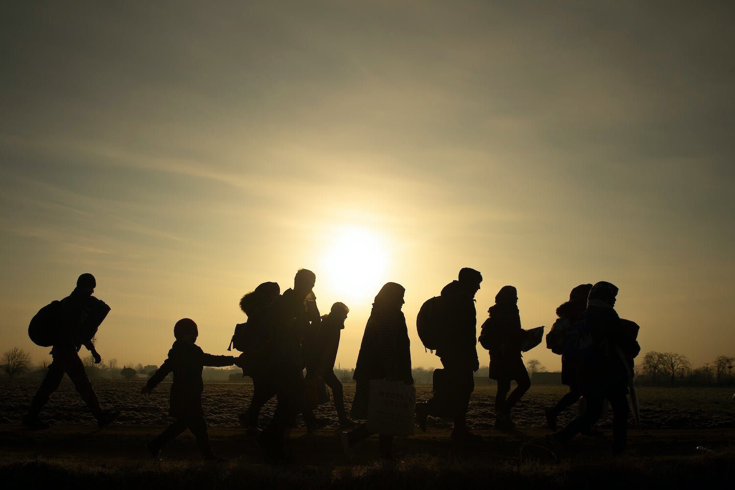 Migrants walk towards the Turkey's Pazarkule border crossing with Greece's Kastanies, in Edirne, Turkey March 1, 202