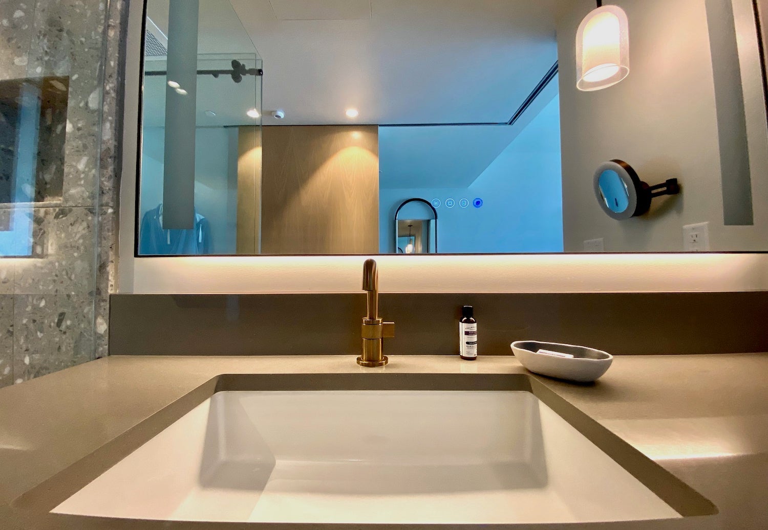 Hotel sink with gold light fixtures