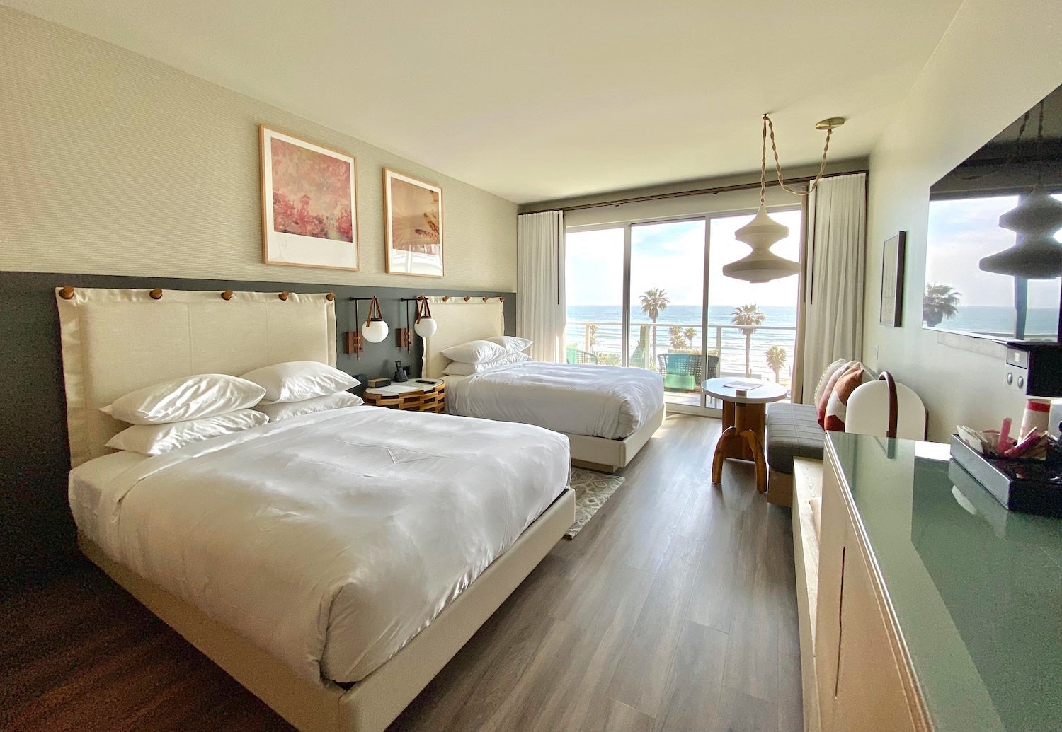 Hotel room with two queen beds and a balcony overlooking the ocean