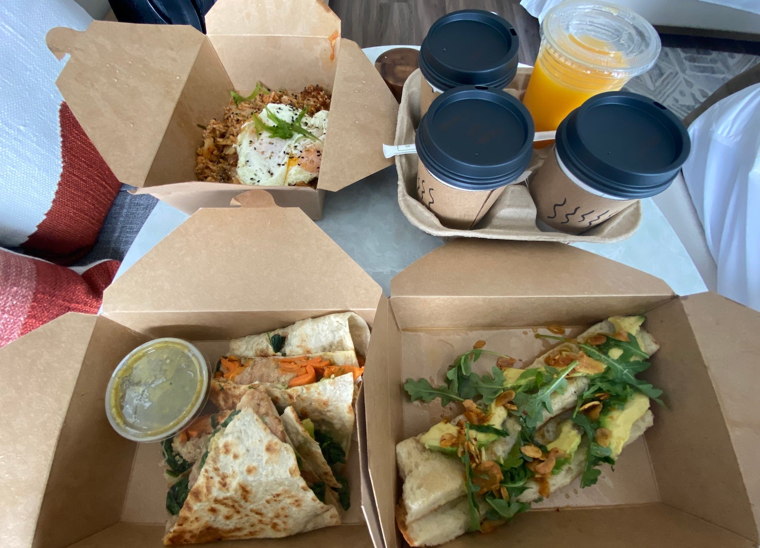 Eggs, avocado toast and A-fRame with coffee and orange toast