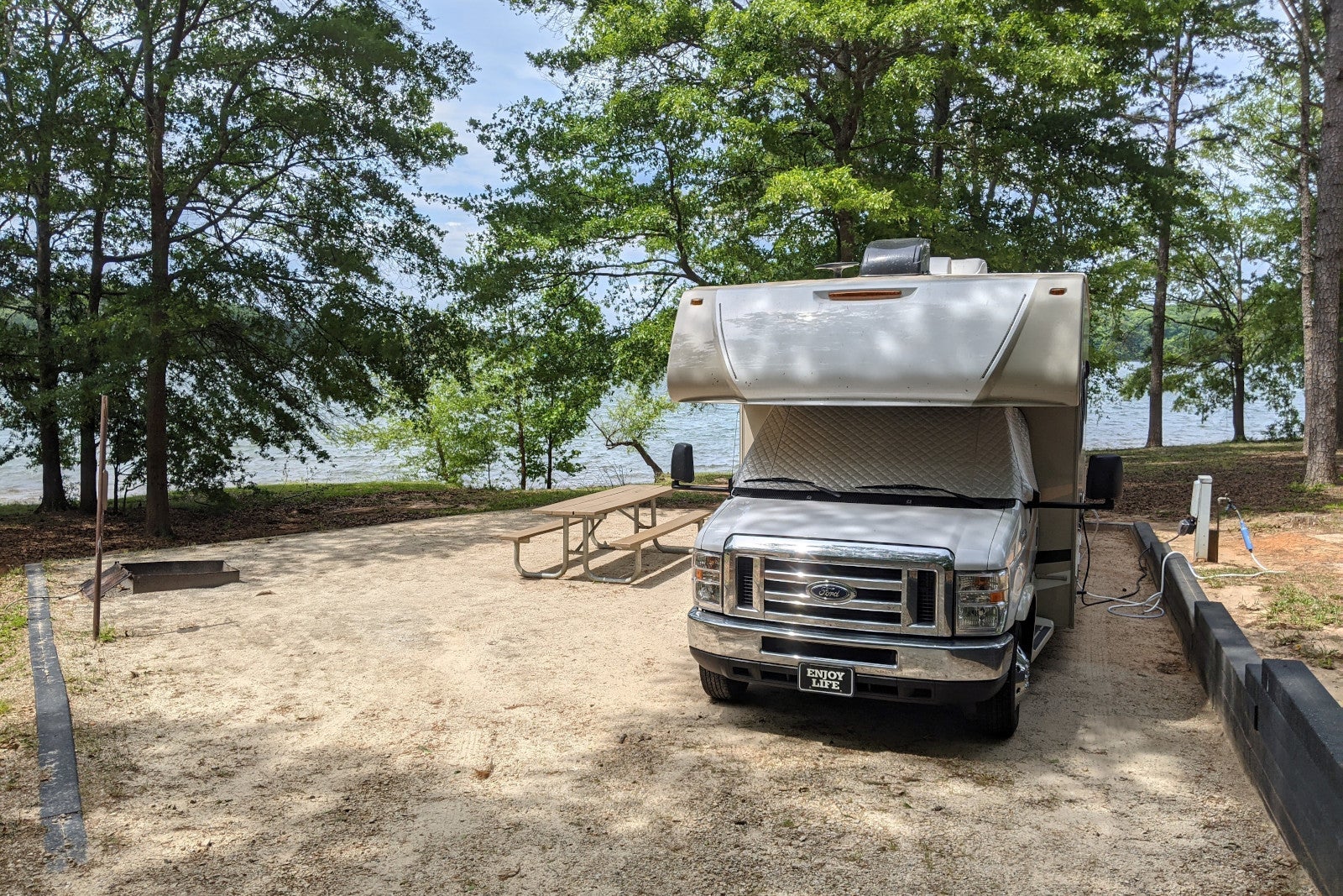 RV in a campground by a lake