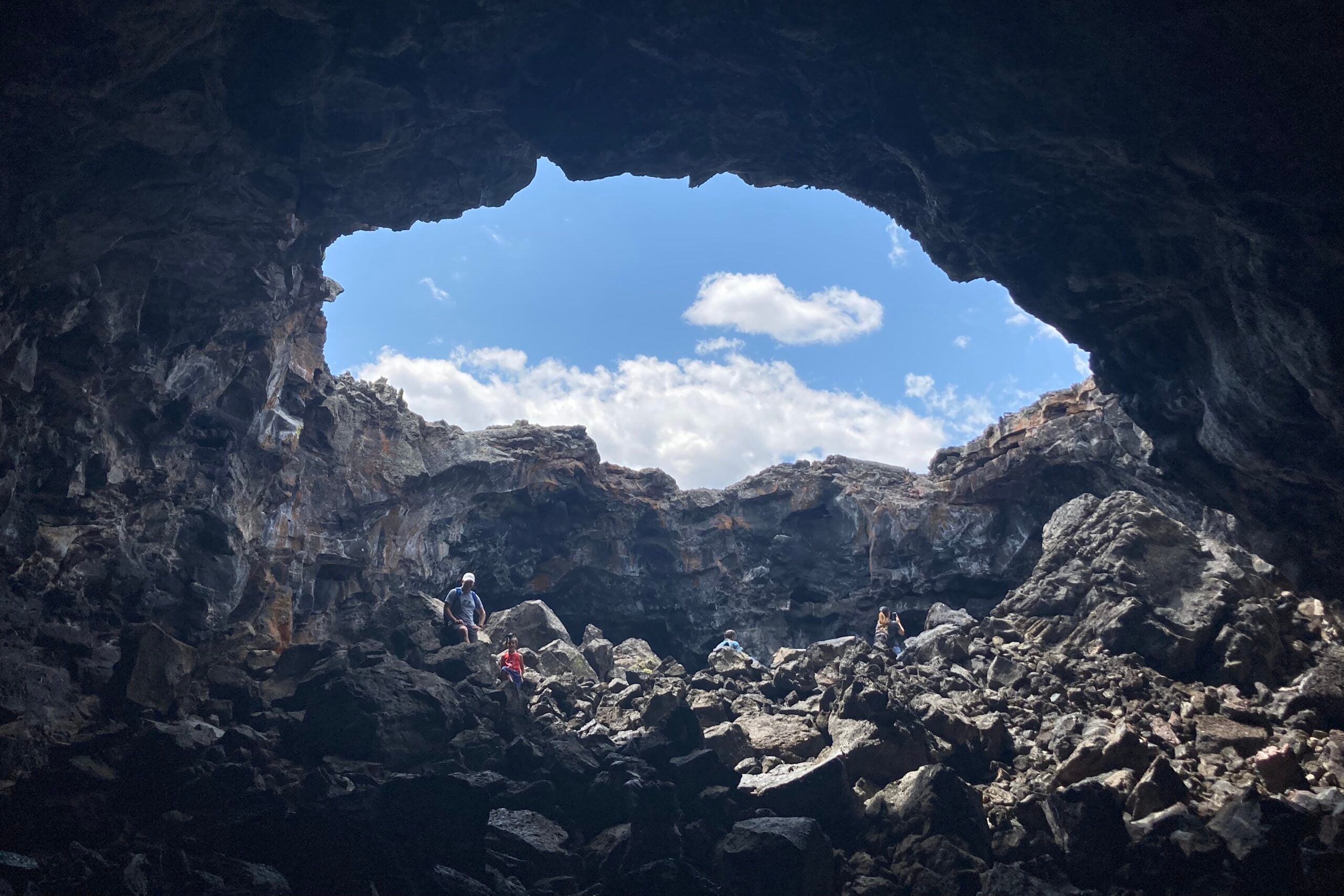 TPG editor Nick Ewen exploring a cave at Craters of the Moon National Monument and Preserve