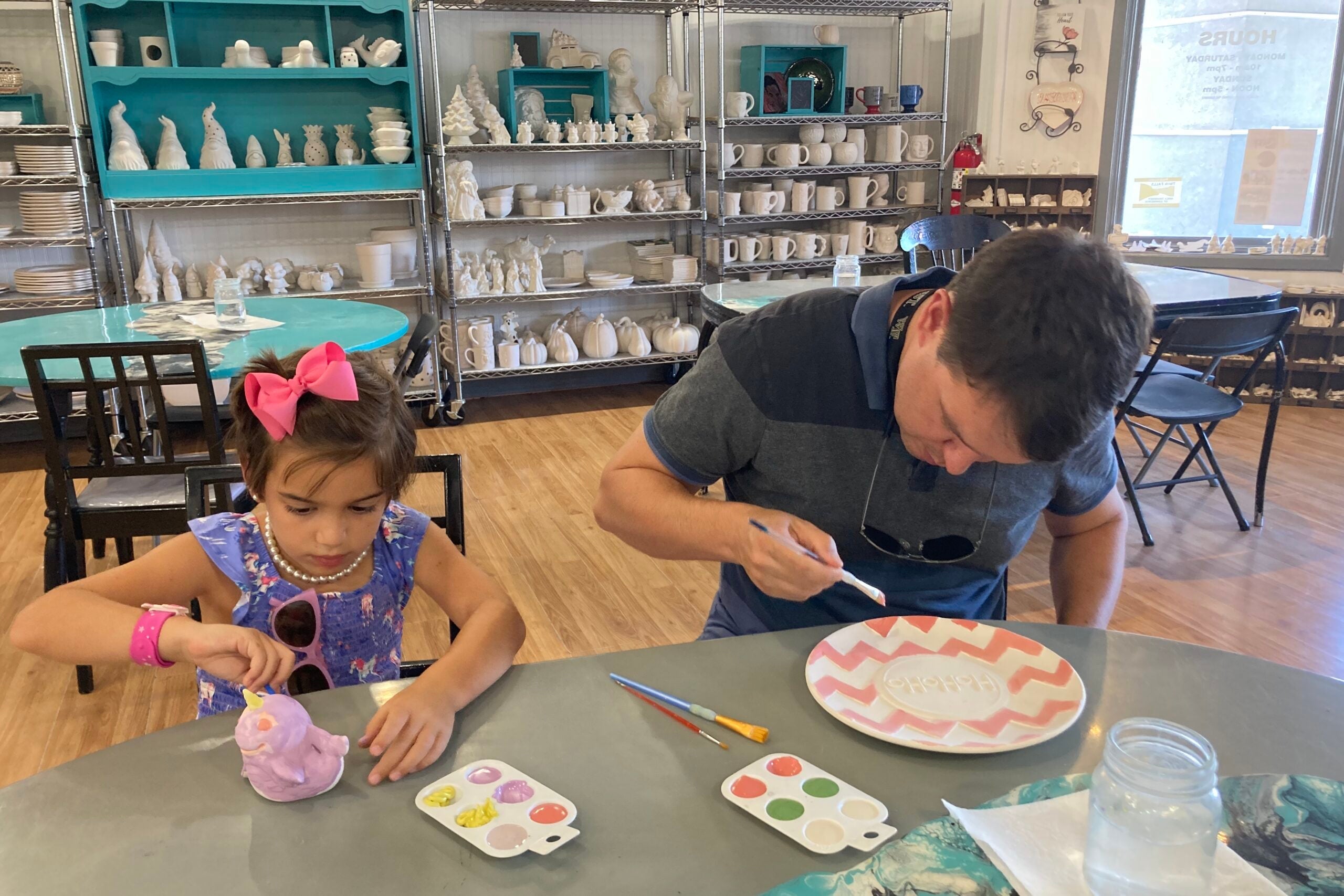 TPG editor Nick Ewen and his daughter painting pottery