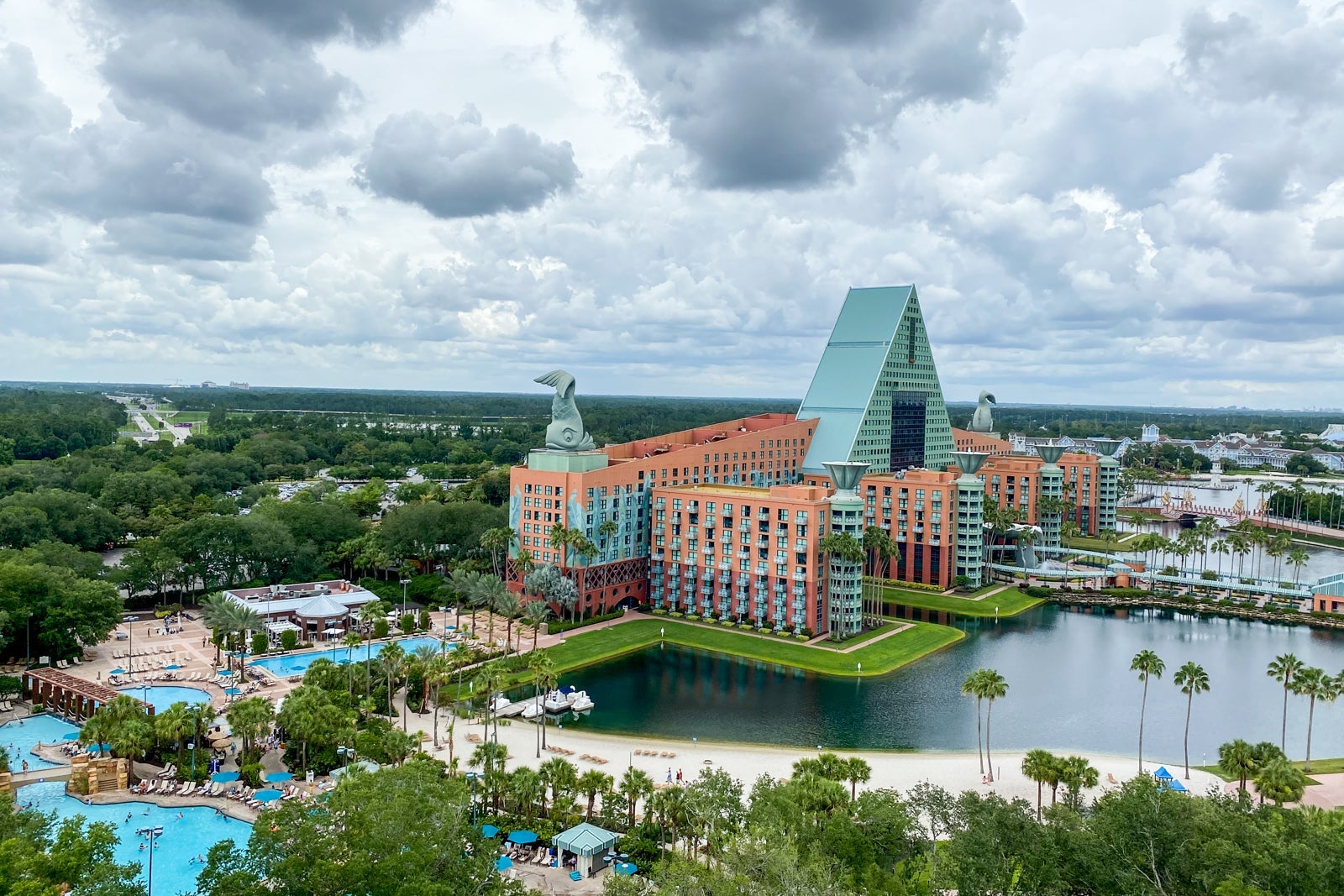 aerial view of a hotel surrounded by lakes