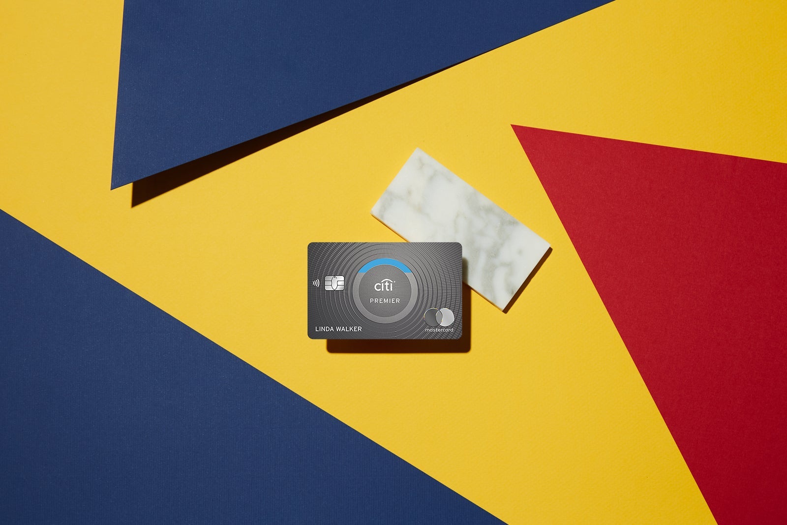 a credit card against a multi-colored background