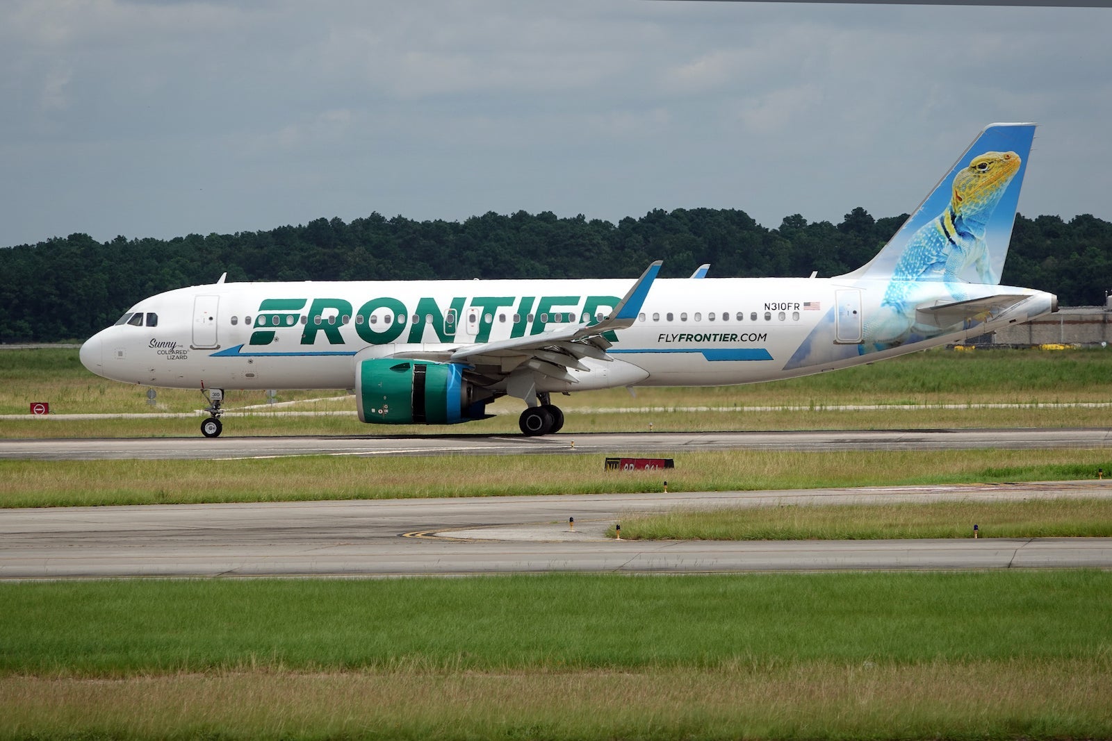 A Frontier Airlines plane on the ground at Houston Bush Intercontinental Airport
