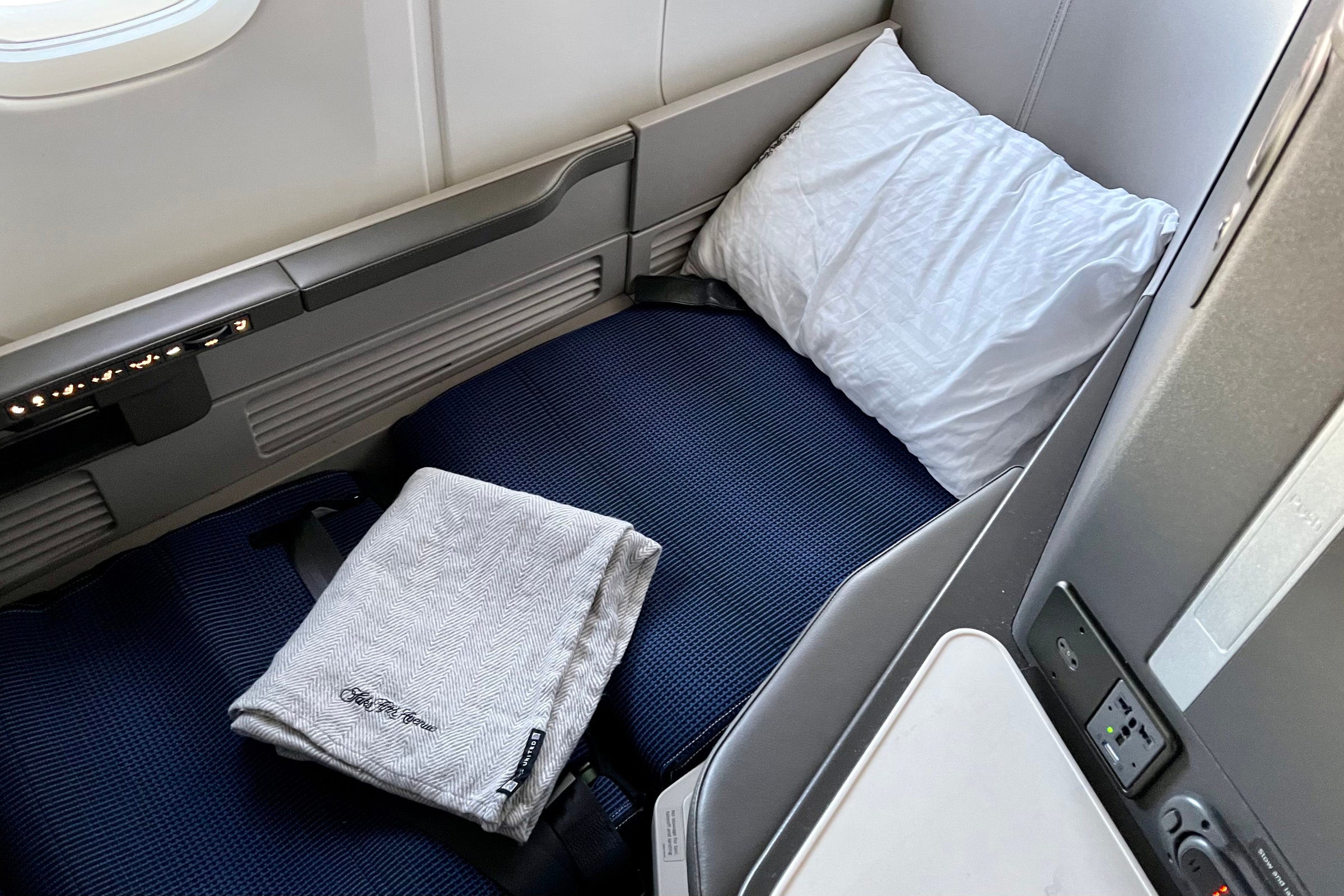a business-class seat in the lie flat position