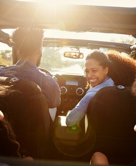 A family inside a car during a road trip