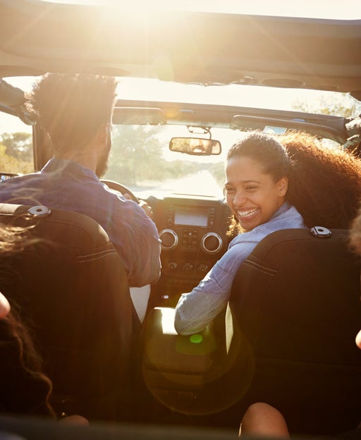A family inside a car during a road trip