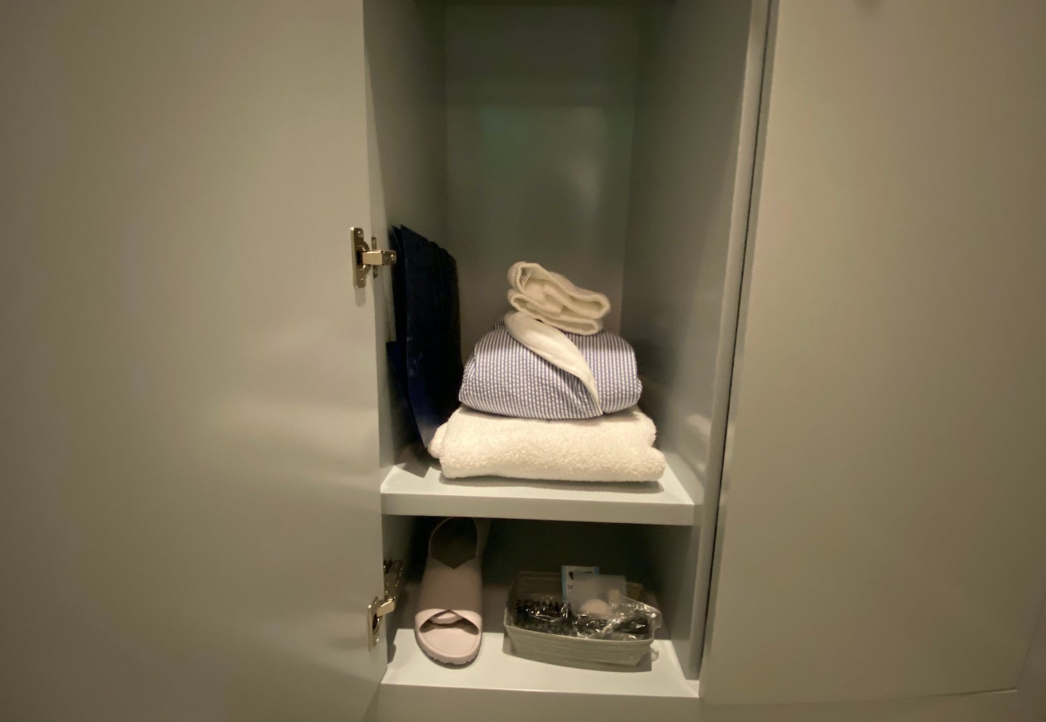 Spa locker stocked with robe, slippers and towels