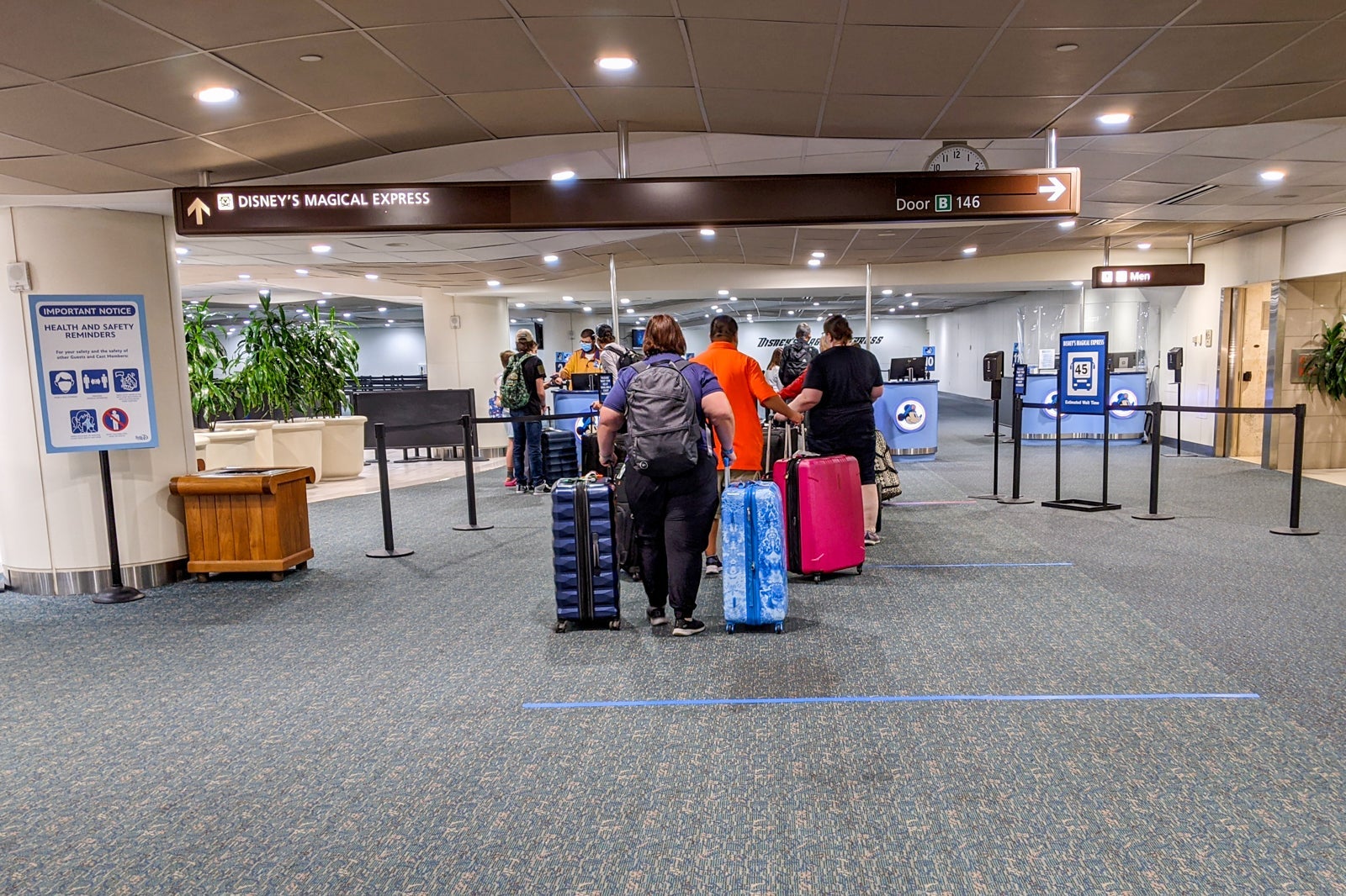 Queue for Disney World's Magical Express bus at the airport