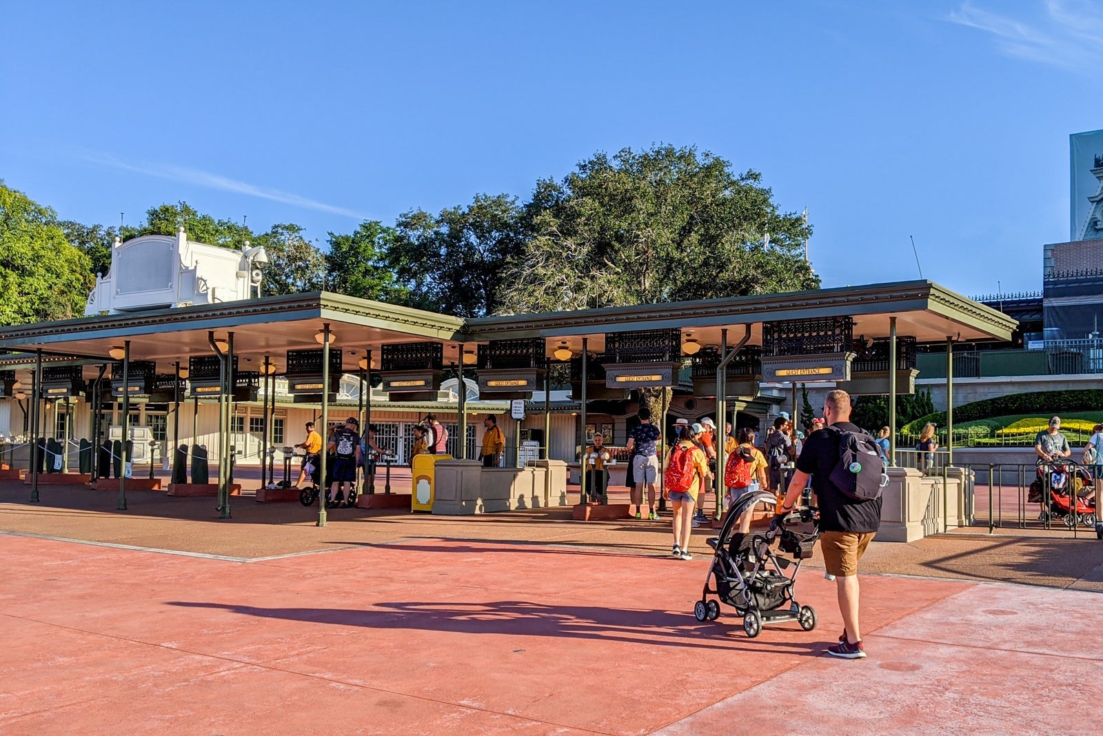 Guests walking to Disney World's Magic Kingdom entrance