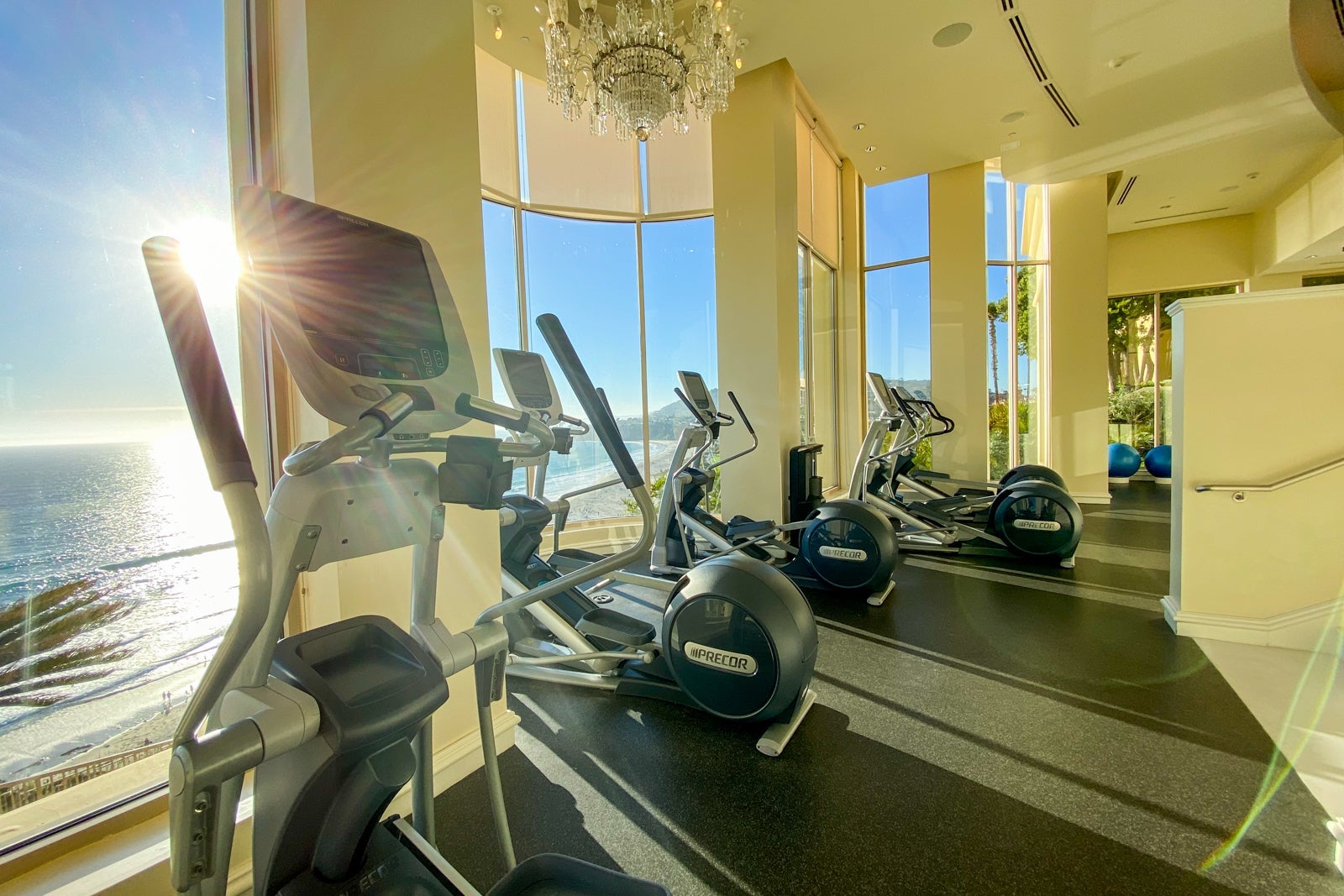 Stationary bikes in hotel gym overlooking the ocean