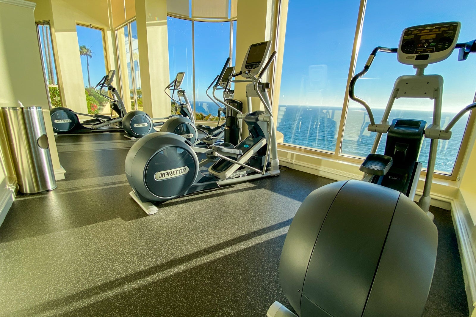 Stationary bikes in hotel gym overlooking the ocean