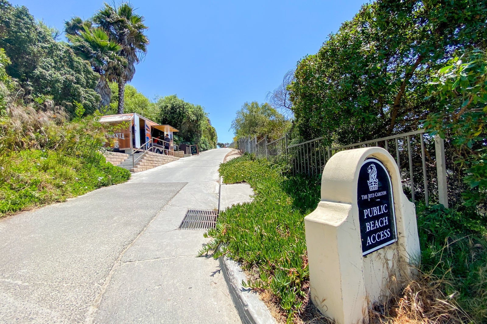 Hill leading up to a small shack housing hotel activities center