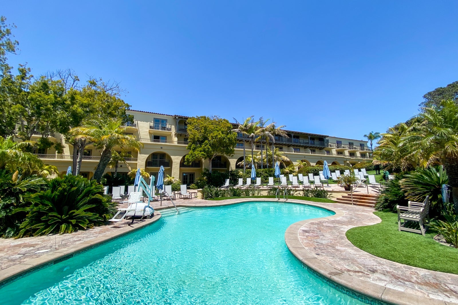 Large hotel kid's pool surrounded by loungers