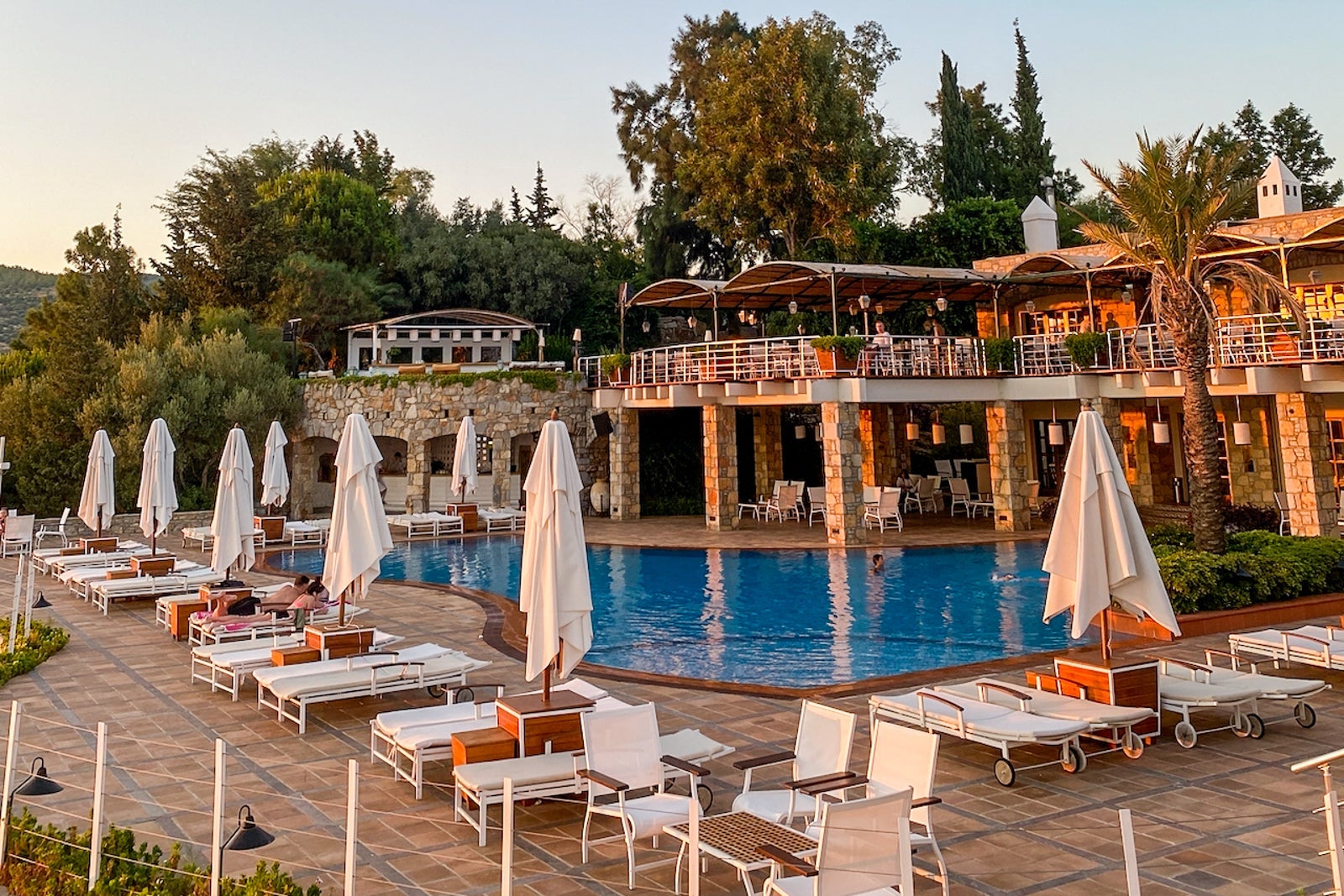 A hotel pool at sunset
