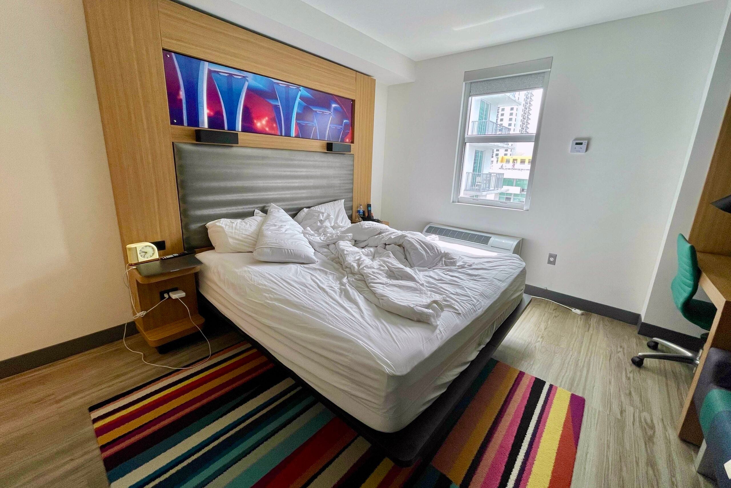 Unmade bed hotel room