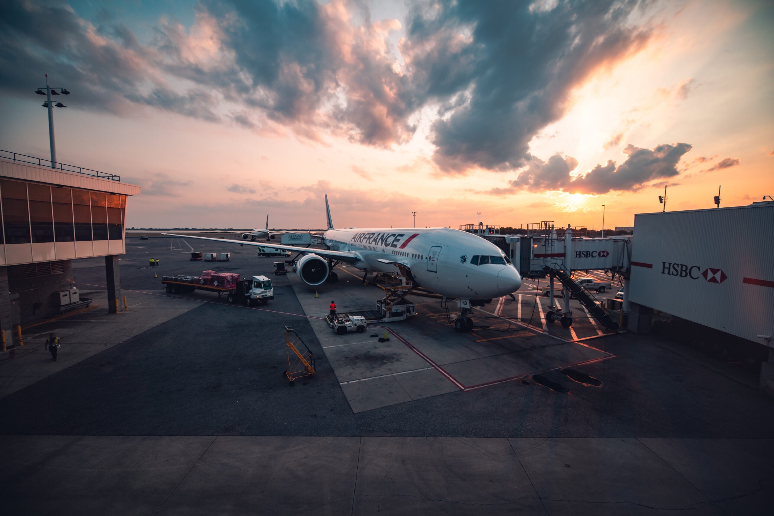 Air France 777-300ER at gate at JFK with sunset