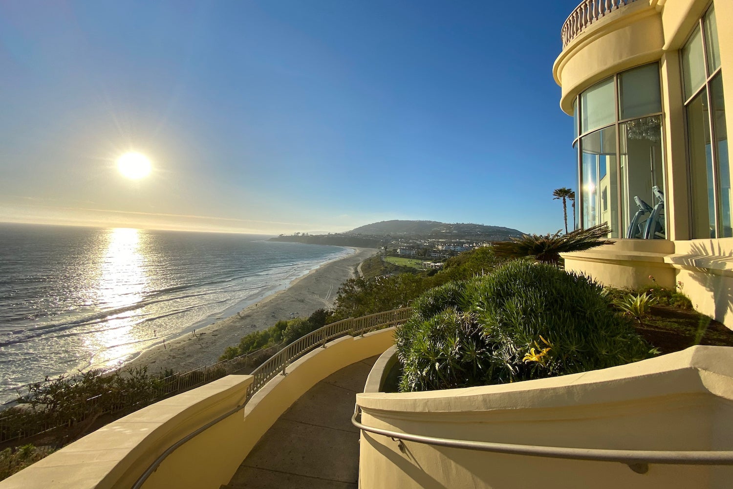 Wheelchair ramp overlooking the beach at sunset