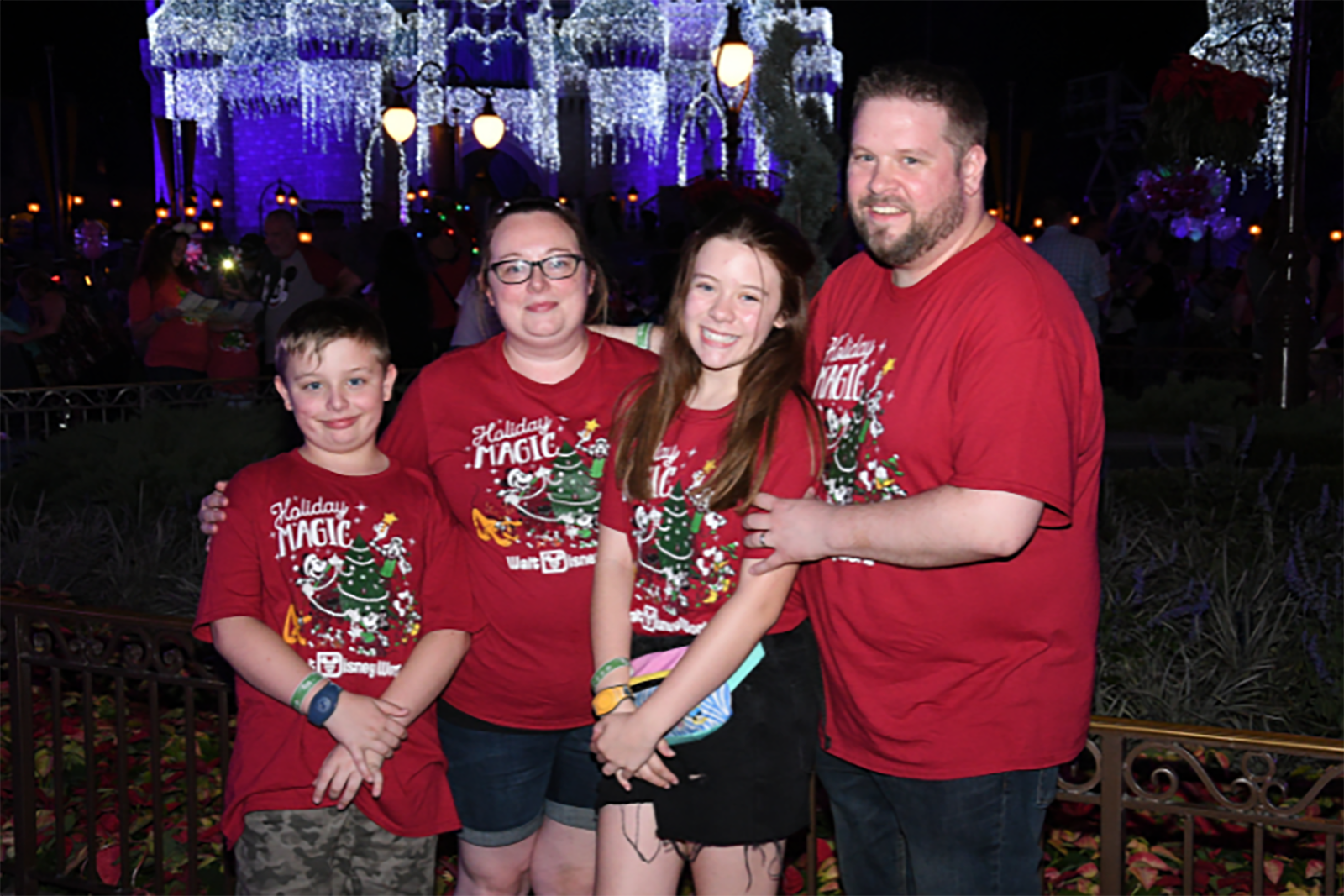 Family wearing matching Disney t-shirts