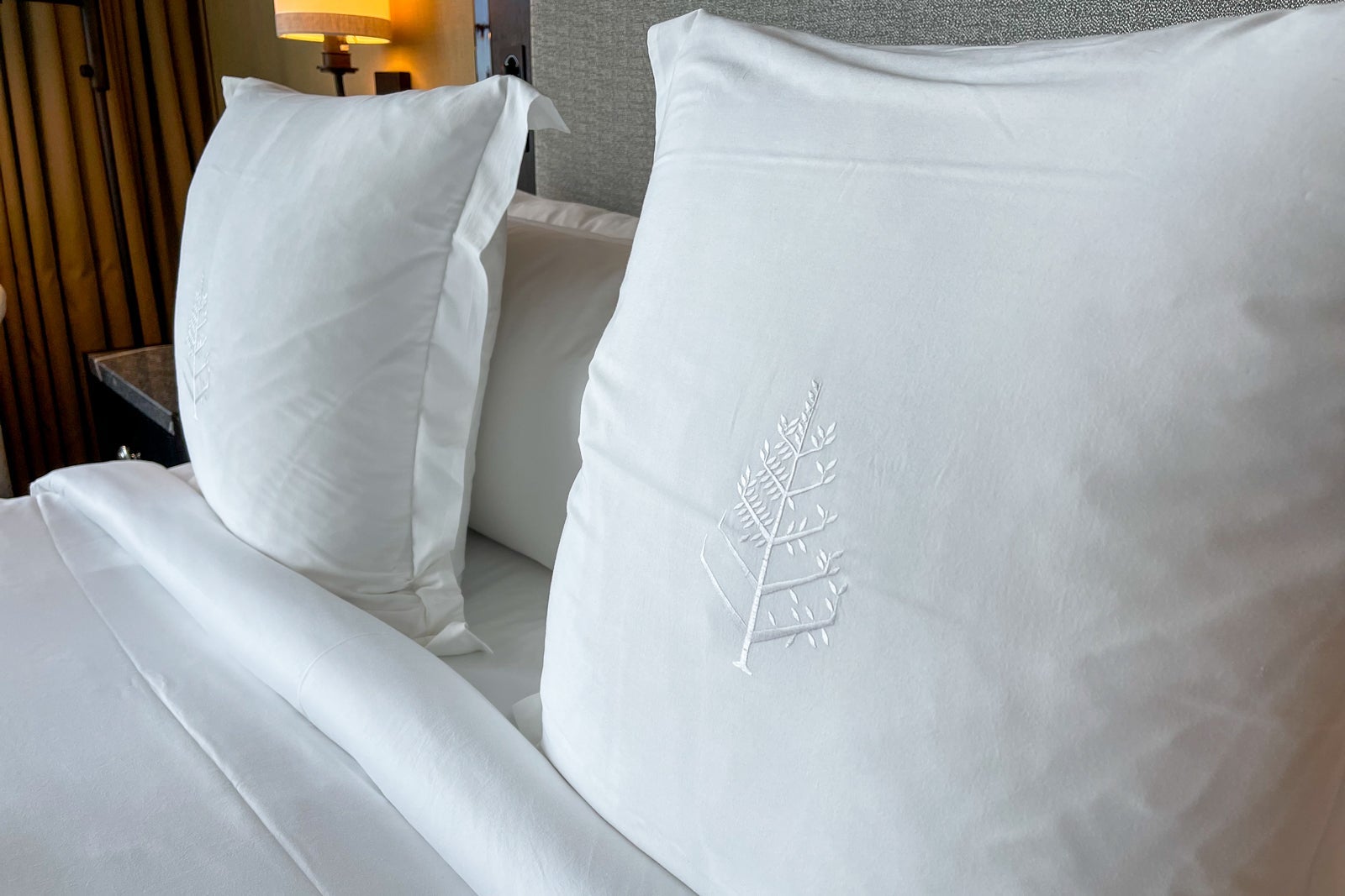 crisp white bedding at Four Seasons One Dalton Street, Boston