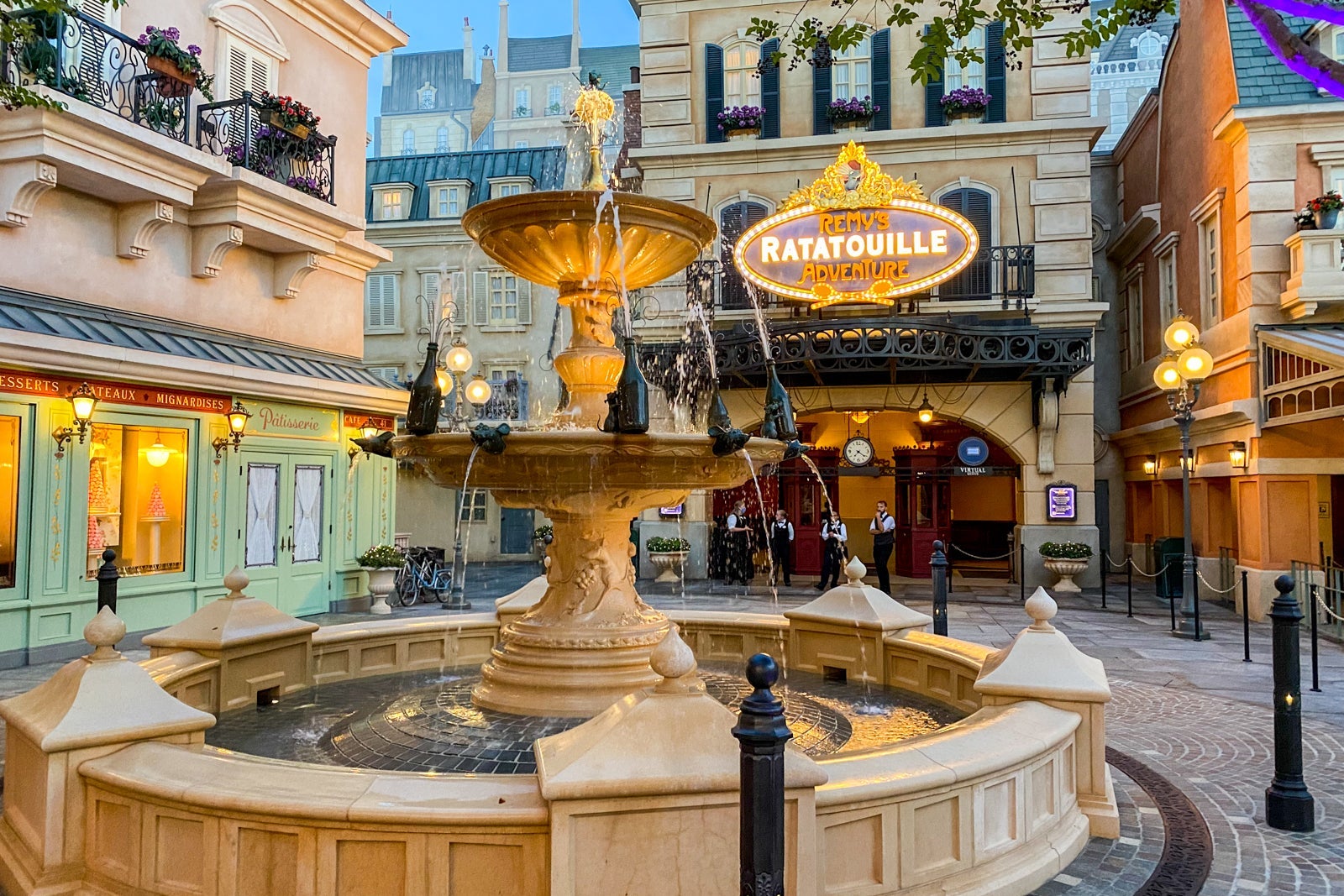 The fountain lit up in front of Disney World's Remy's Ratatouille Adventure attraction.