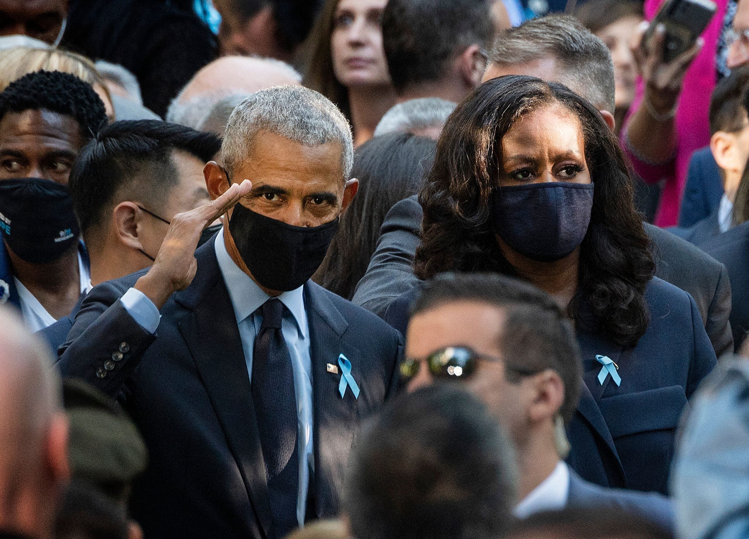 TOPSHOT - Former President Barack Obama (L) and First Lady Michelle Obama attend the ceremony at the National 9/11 Memorial marking the 20th anniversary of the 9/11 attacks on the World Trade Center, in New York, on September 11, 2021. (Photo by Jim WATSON / AFP) (Photo by JIM WATSON/AFP via Getty Images)