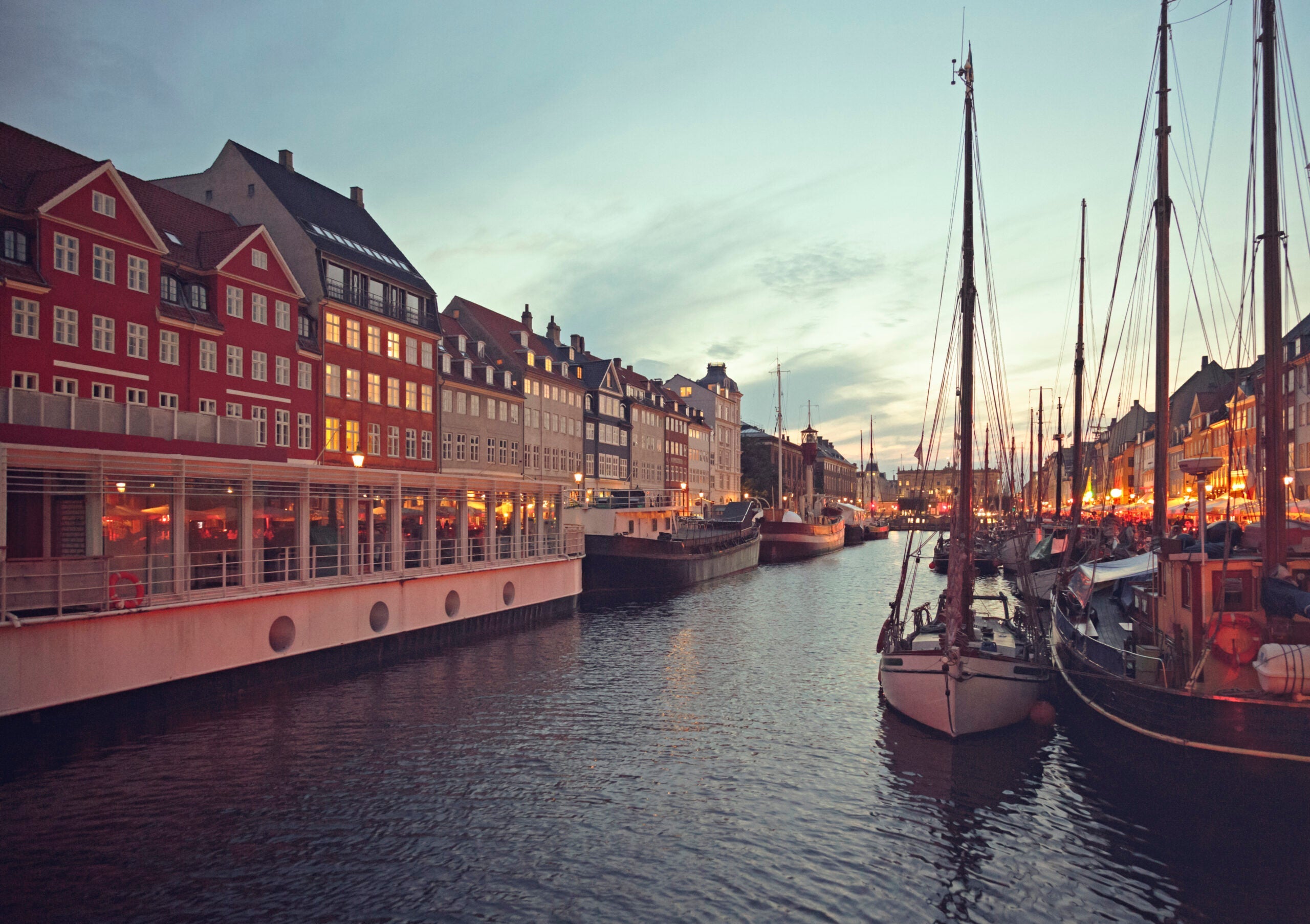 Nyhavn in Copenhagen, Denmark at dusk.