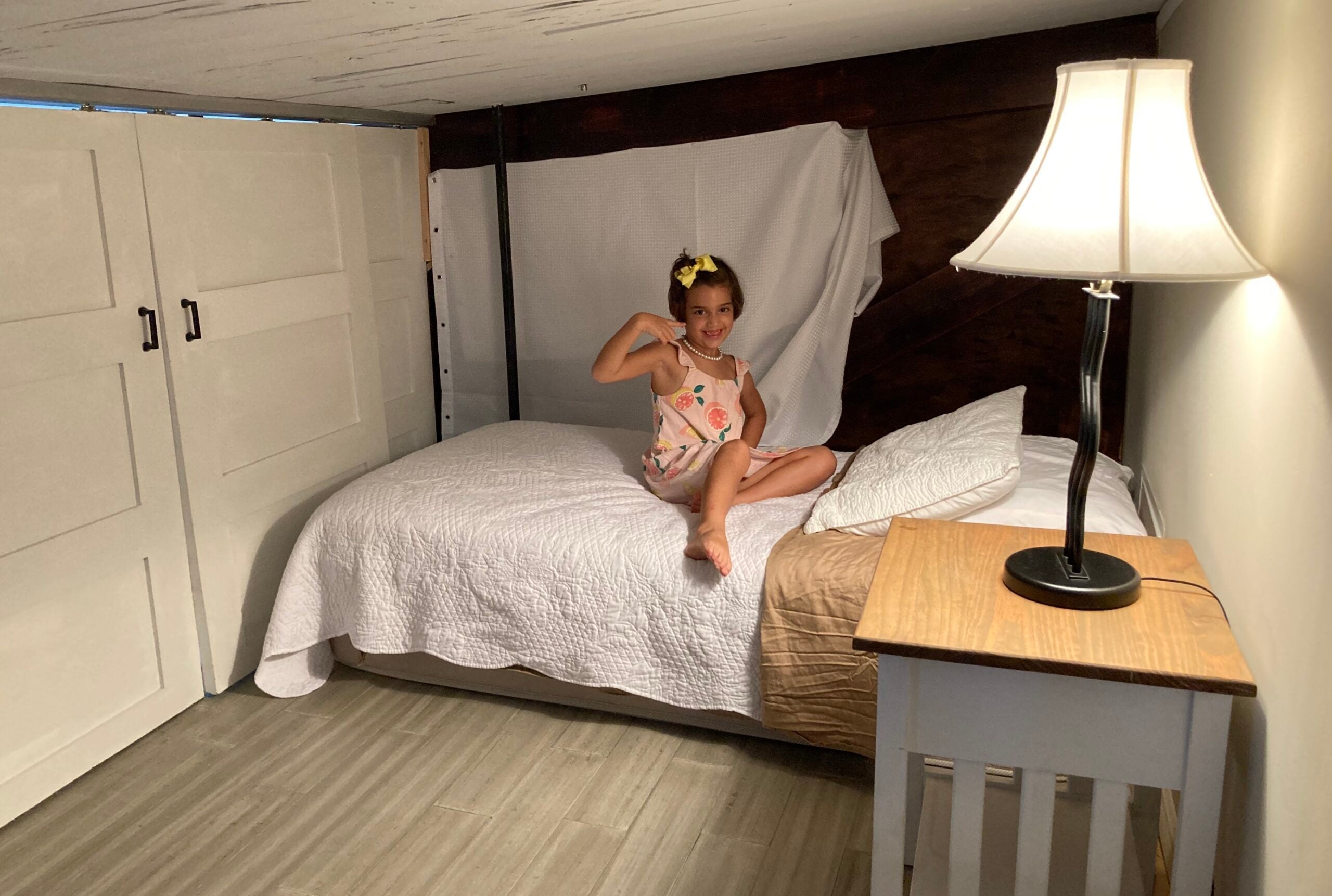 Nick Ewen's daughter in the loft bedroom of an Airbnb in Palm Beach, Florida
