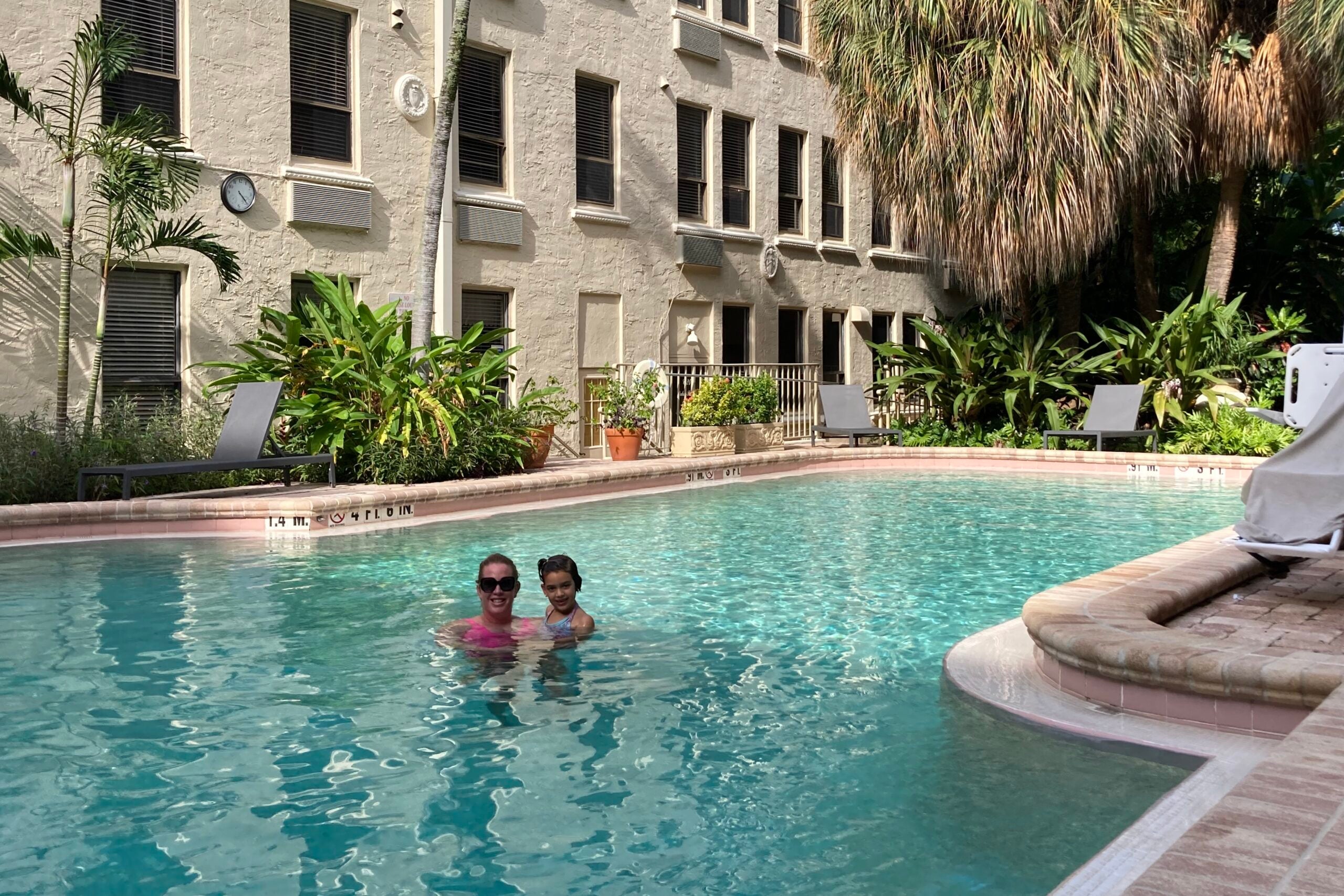 Nick Ewen's wife and daughter in the pool at an Airbnb in Palm Beach, FL