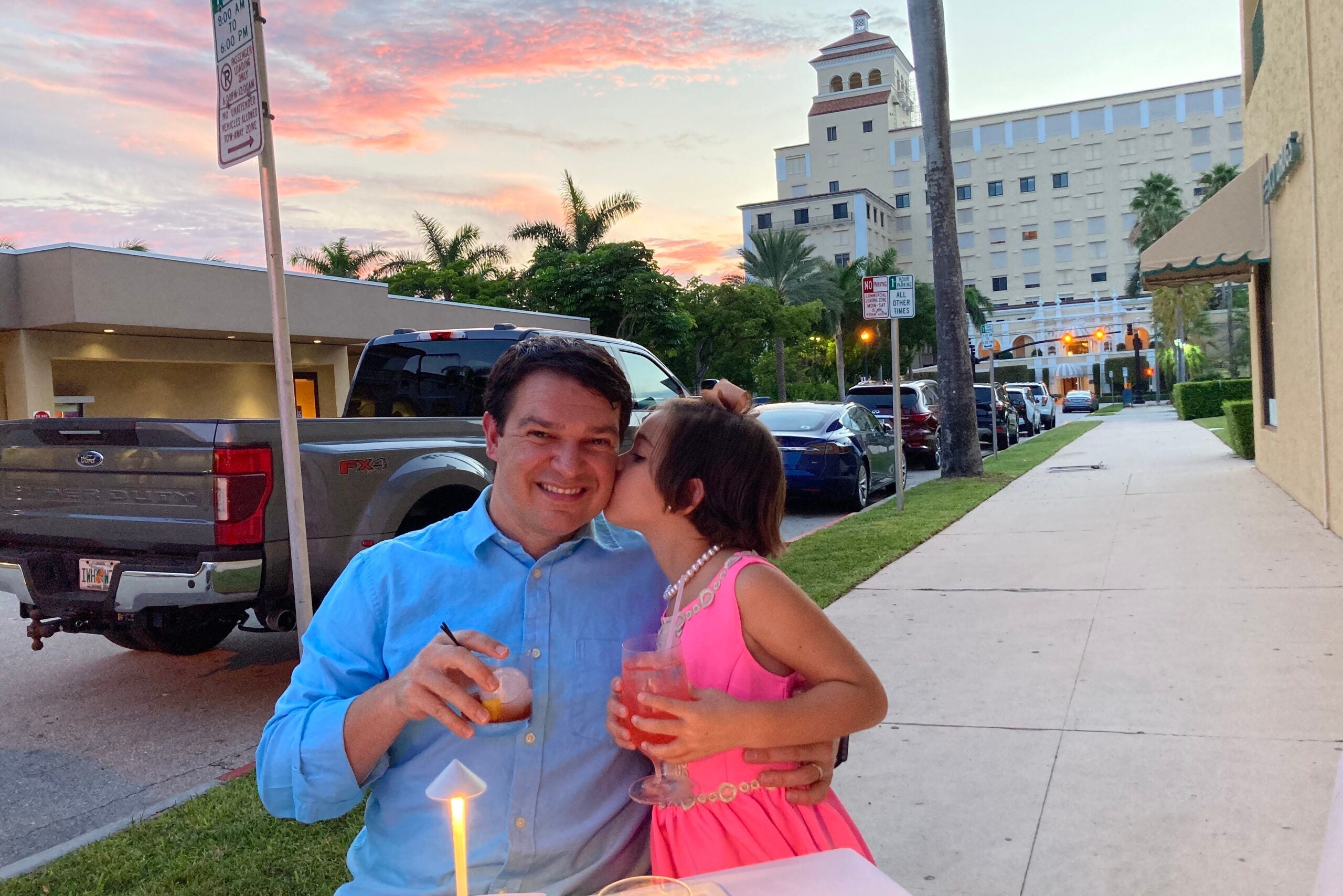 TPG editor Nick Ewen and his daughter dining outside in Palm Beach, Florida