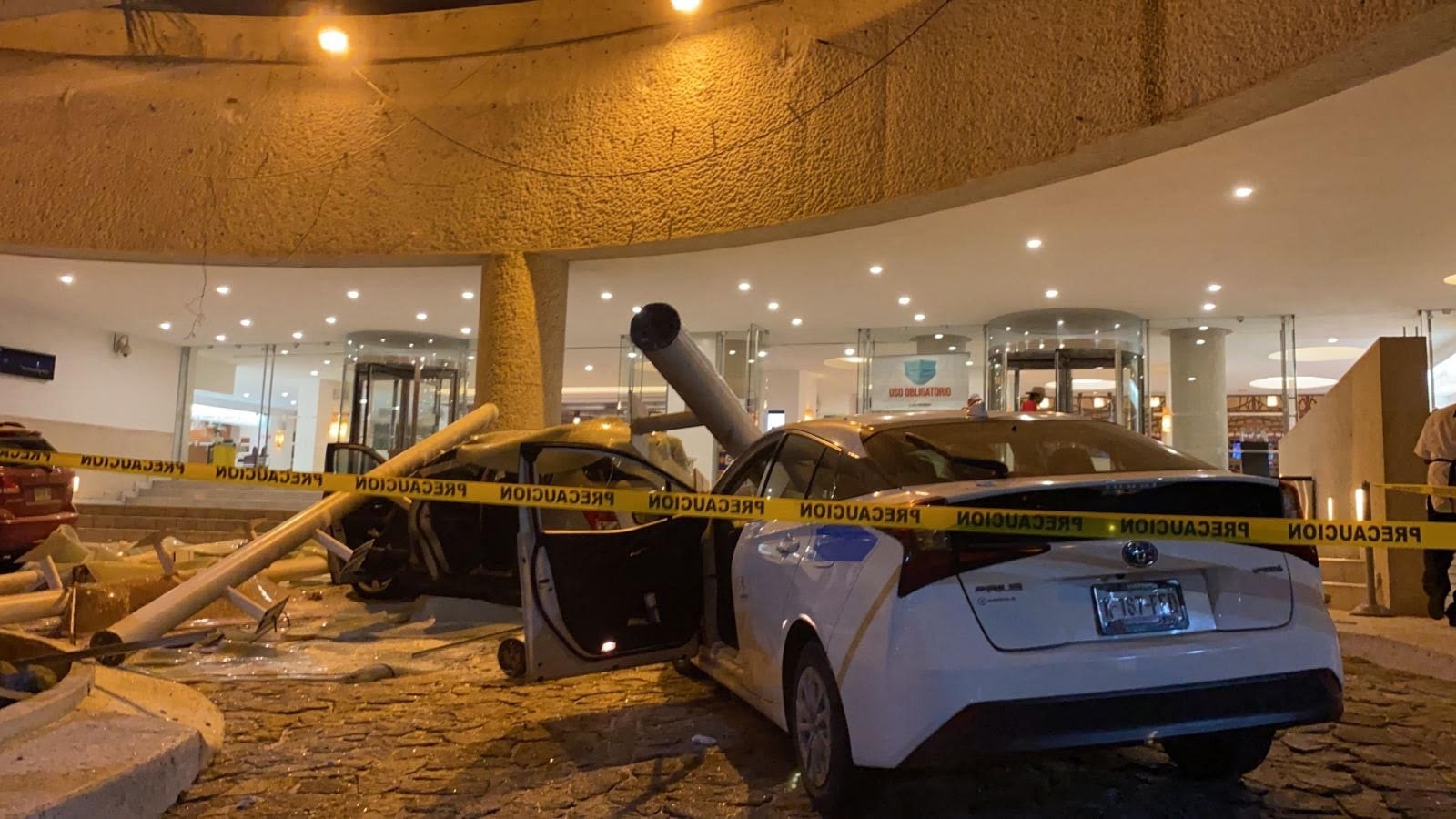 View of damaged cars outside a hotel after a quake in Acapulco, Guerrero state, Mexico on September 7, 2021. - A 6.9 magnitude earthquake struck Mexico on Tuesday near the Pacific coast, the National Seismological Service said, shaking buildings in the capital. The epicenter was 14 kilometers (nine miles) southeast of the beach resort of Acapulco in Guerrero state, the service said. (Photo by FRANCISCO ROBLES / AFP) (Photo by FRANCISCO ROBLES/AFP via Getty Images)