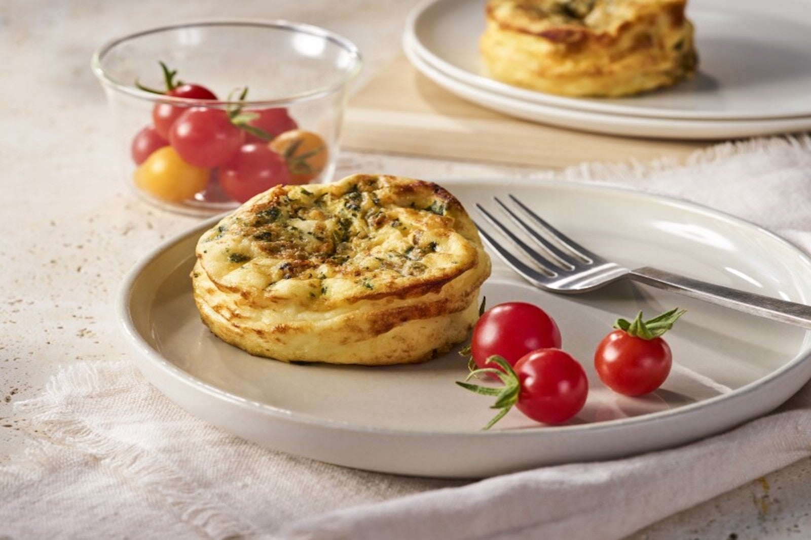 egg quiche with tomatoes on plate